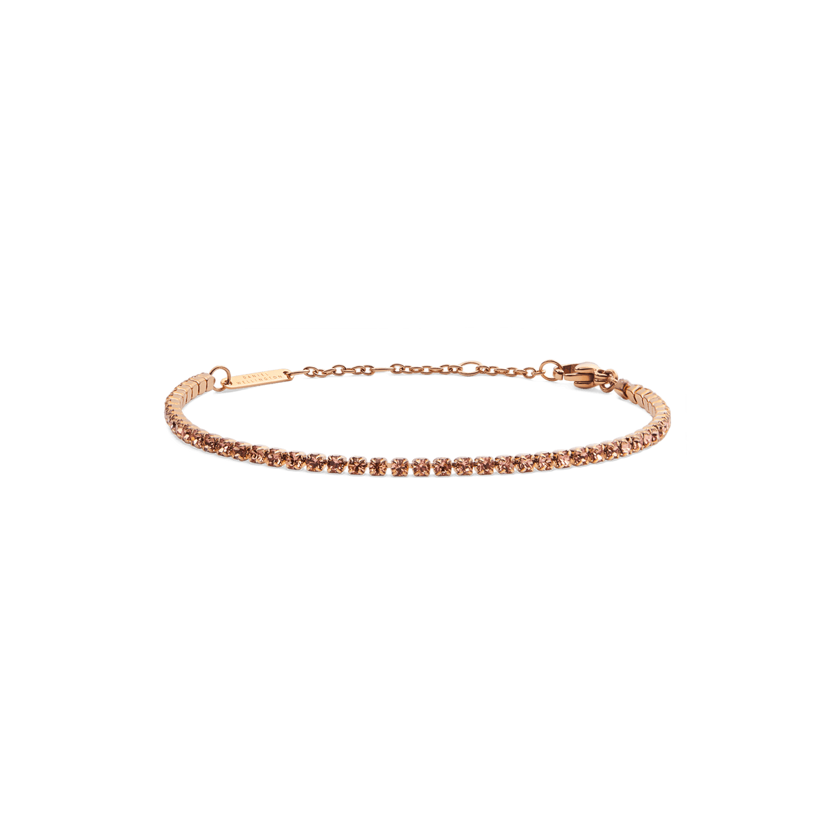 Slim rose gold tennis bracelet featuring apricot-coloured crystals, adjustable chain and lobster clasp, designed for a refined and modern look.