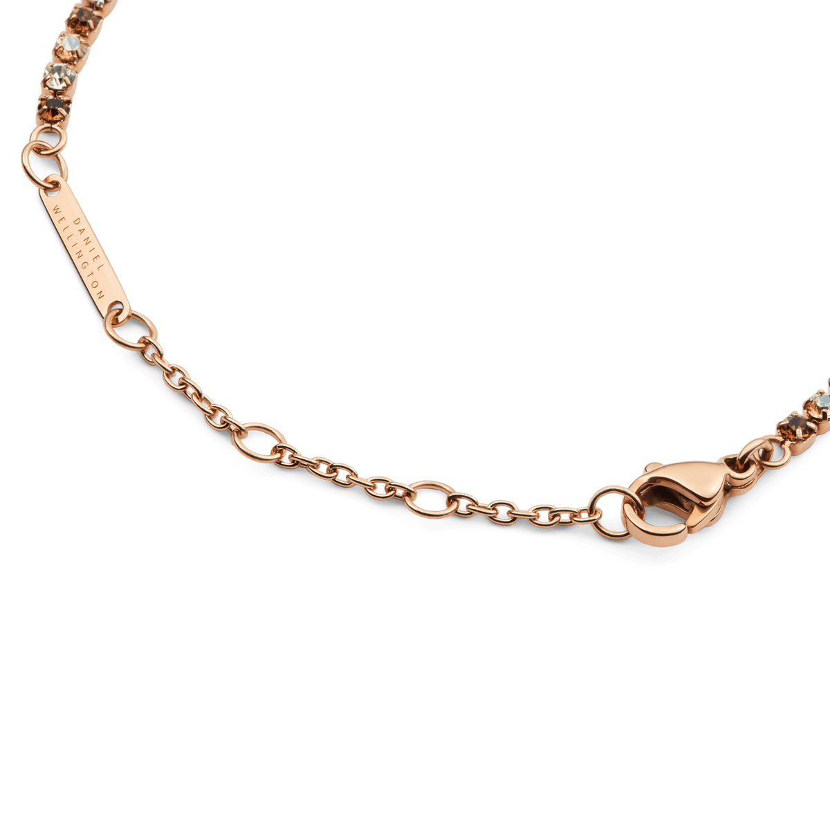 Detail of the Classic Tennis Bracelet Honey Combo Rose Gold, highlighting the rose gold adjustable chain, secure lobster clasp, and alternating honey and clear crystals.