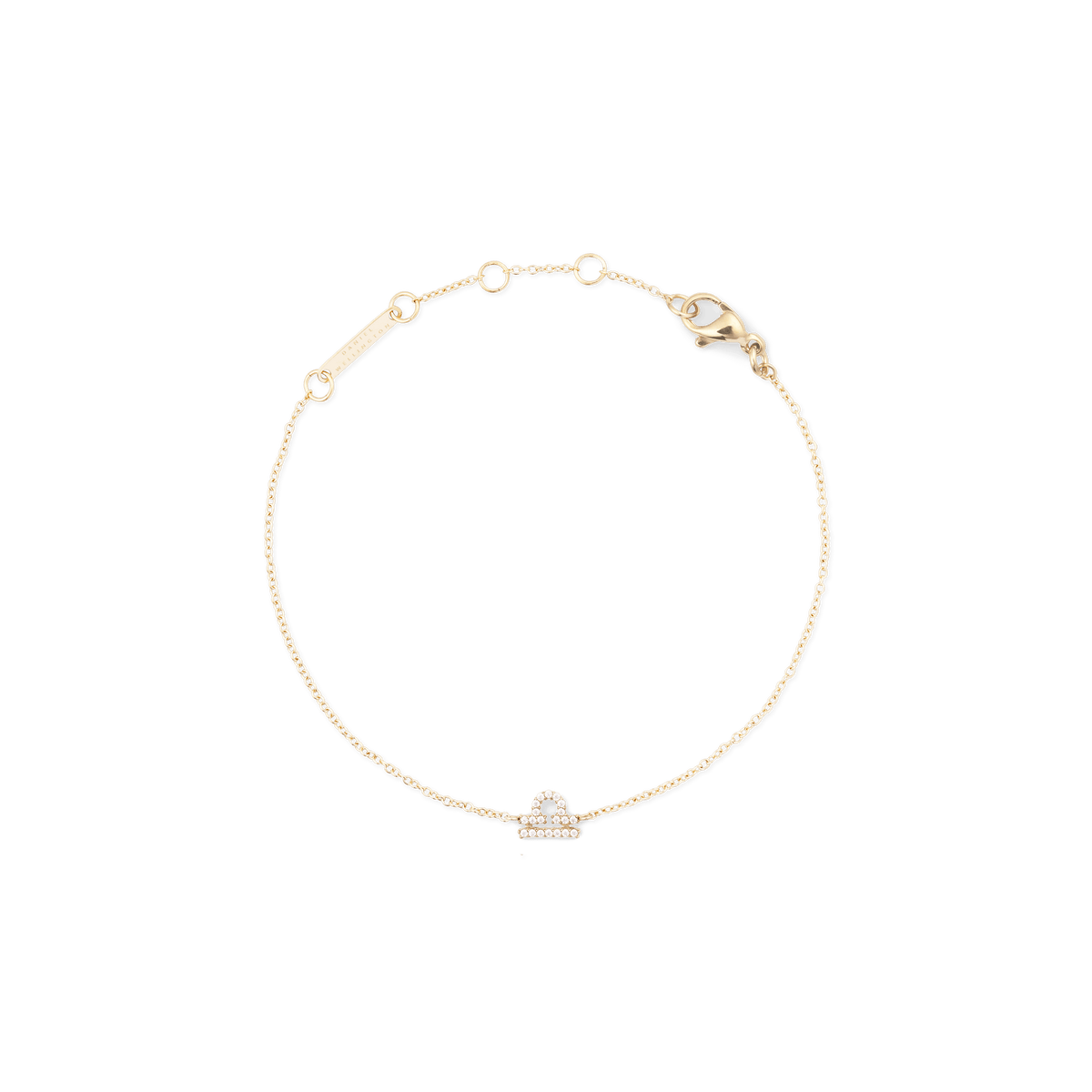 Crystal Zodiac Chain Bracelet Gold featuring a delicate gold chain with an adjustable clasp and a sparkling Libra zodiac charm set with crystals.