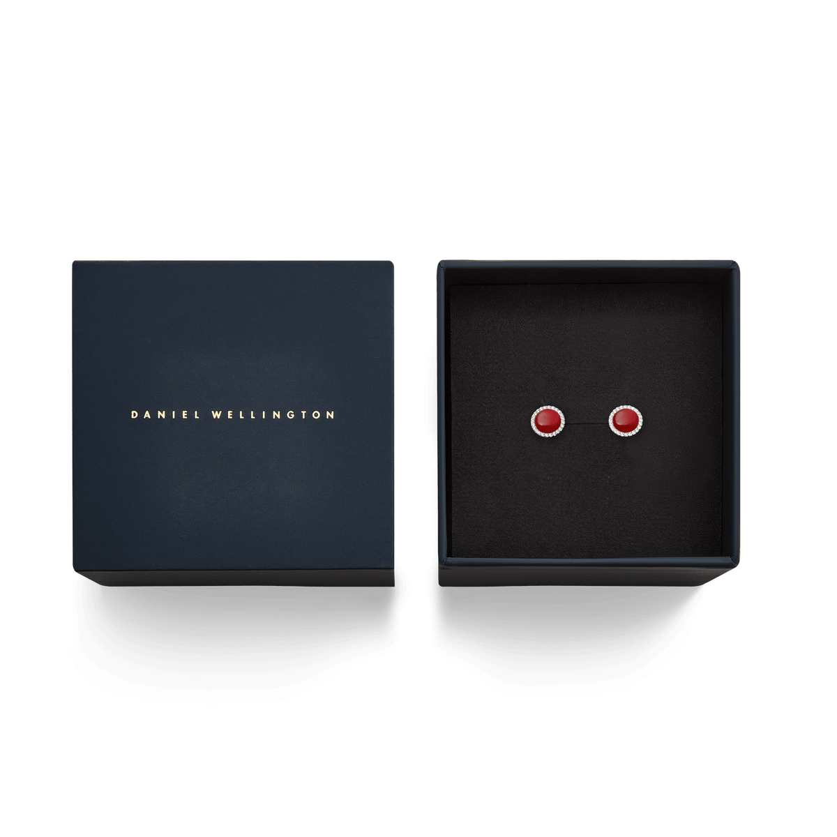 Audrey Earrings Red Agathe Silver presented in a navy Daniel Wellington gift box, showcasing the domed red agate studs with white cubic zirconia halos set in polished silver.