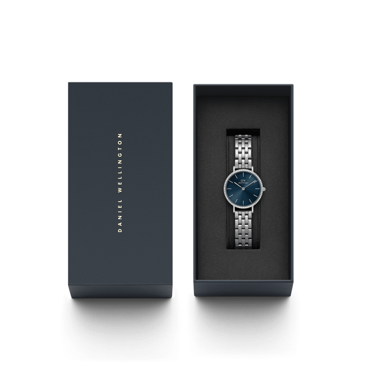 Petite Lumine Bezel 5-Link Arctic S silver watch with a deep blue dial and crystal bezel, elegantly presented in a branded Daniel Wellington gift box.