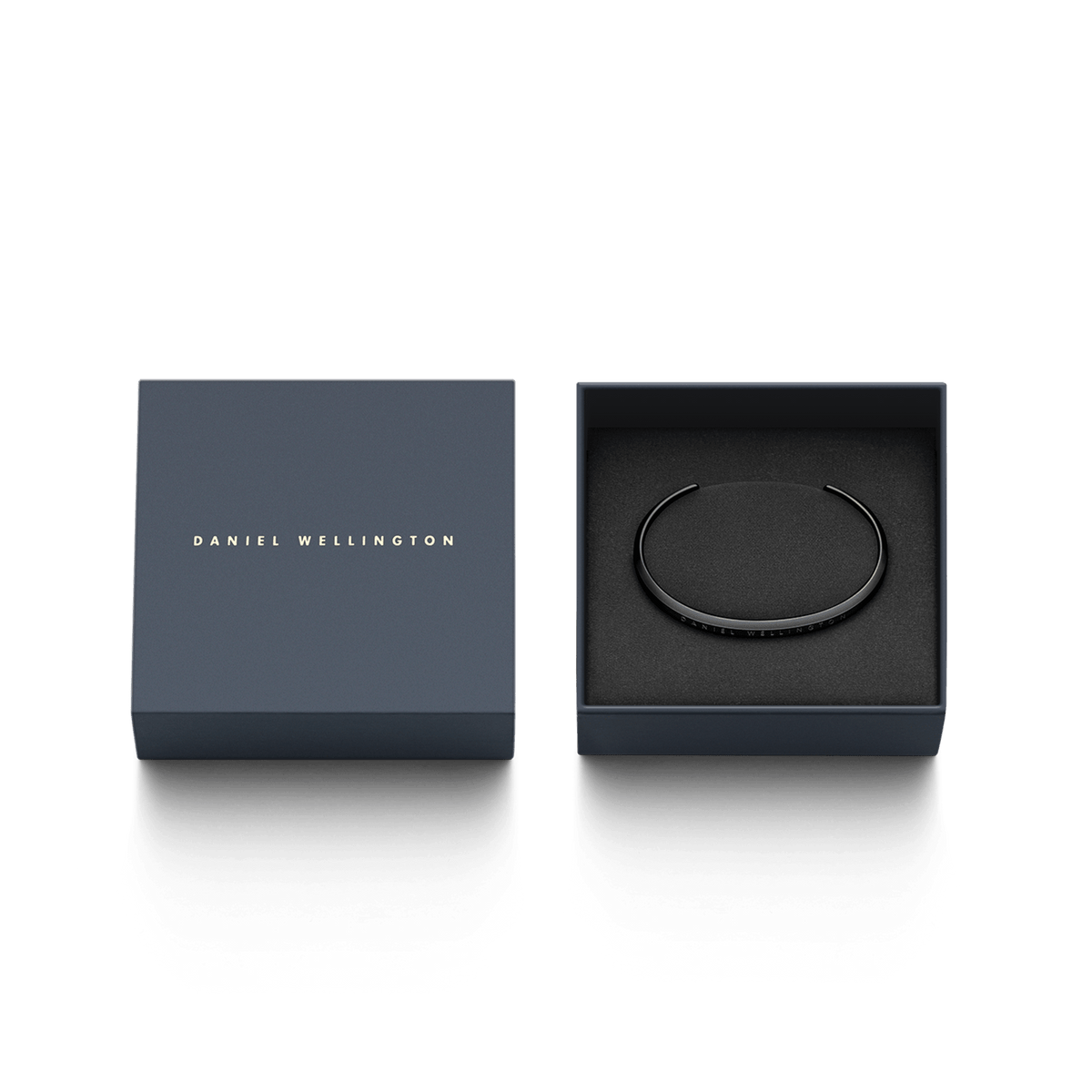 Classic Bracelet in matte black stainless steel displayed in an elegant Daniel Wellington gift box, highlighting its slim cuff design and engraved branding.