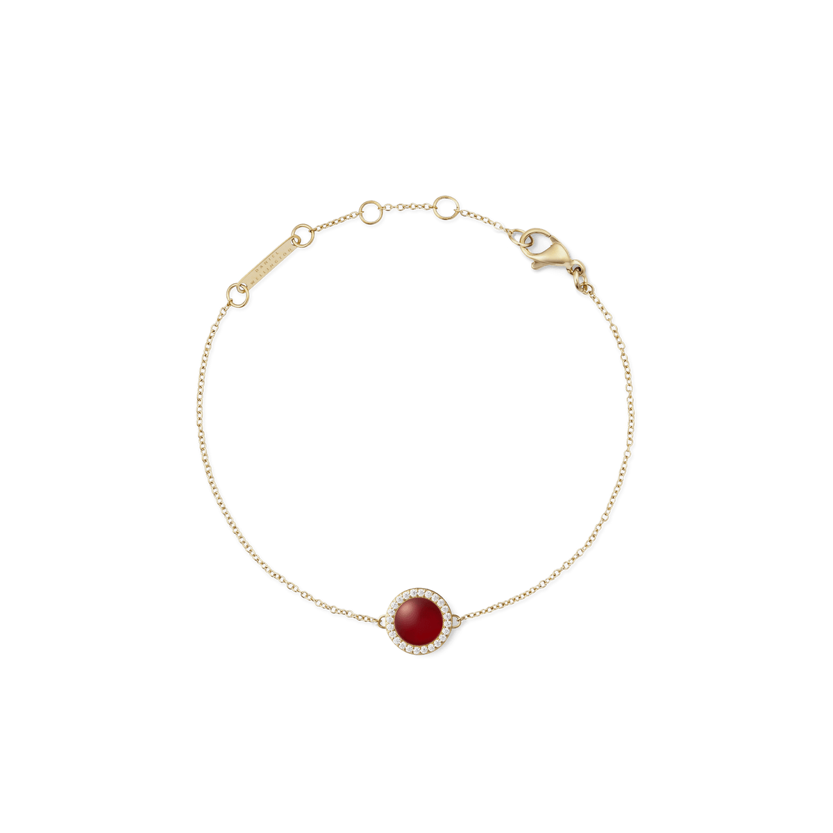 Delicate gold bracelet featuring a slim adjustable chain and a central domed red agate stone, surrounded by a halo of sparkling white cubic zirconia crystals.