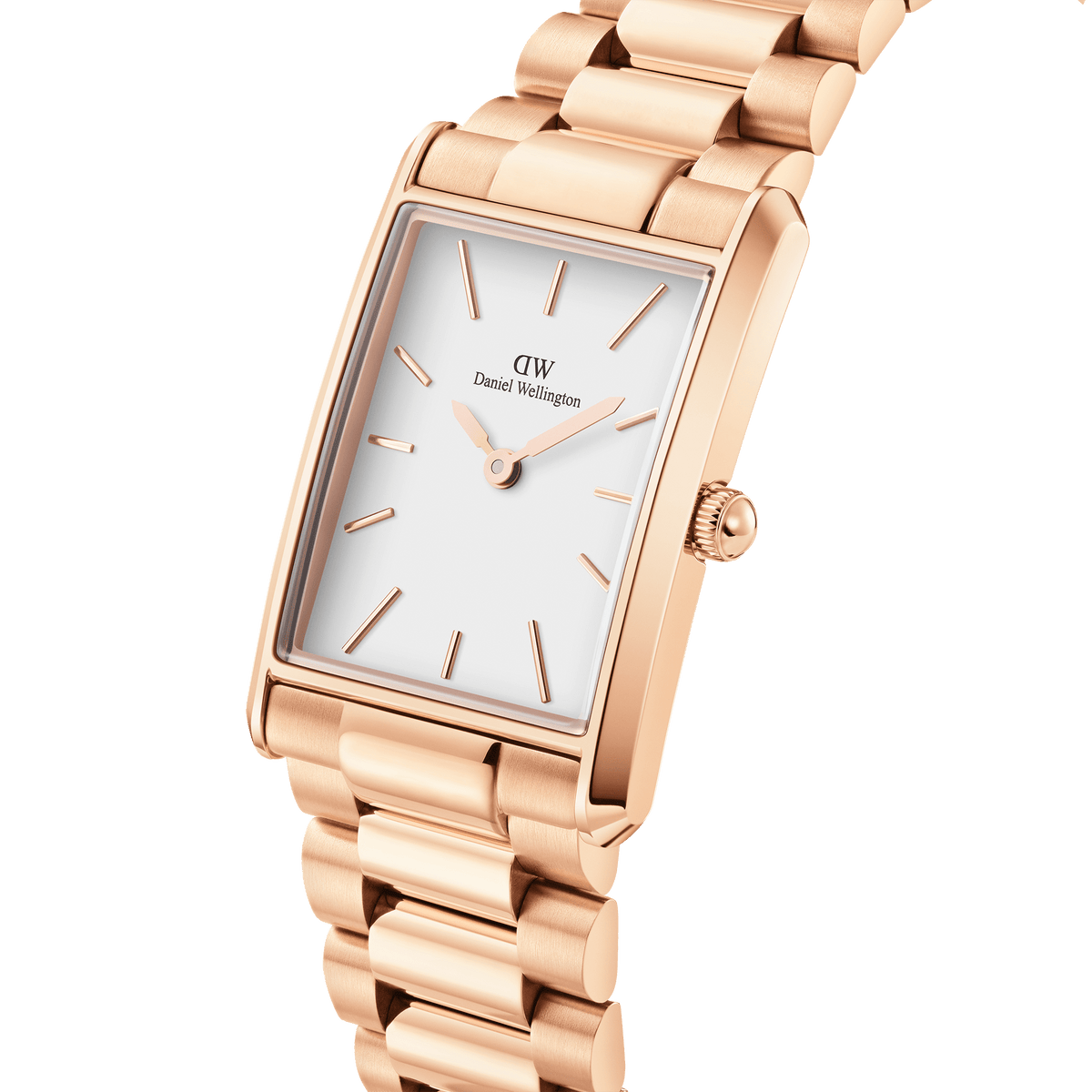 Bound 3-Link Rose Gold watch with a rectangular rose gold case, minimalist white dial, and polished 3-link bracelet, shown in a close-up angle highlighting its geometric edges and refined finish.