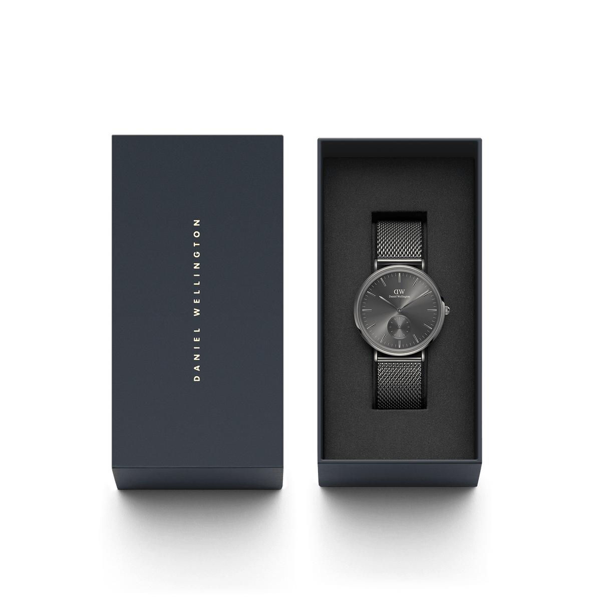 Classic Multi-Eye Mesh Graphite men's watch with a graphite sunray dial and stainless steel mesh strap, presented in a sleek Daniel Wellington gift box.
