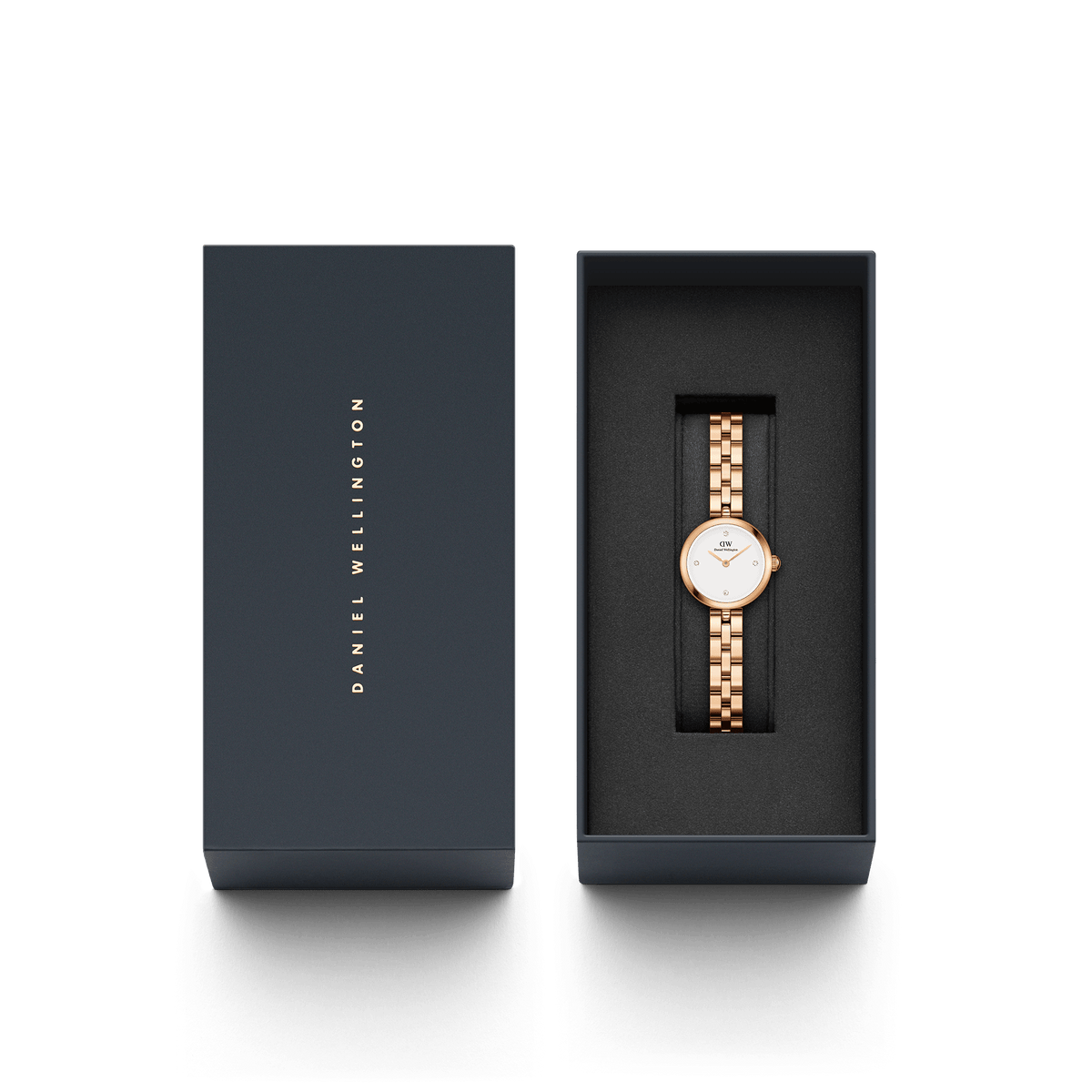 Elan Lumine Rose Gold ladies watch with a rose gold three-link bracelet and minimalist white dial, elegantly presented in a Daniel Wellington branded gift box.