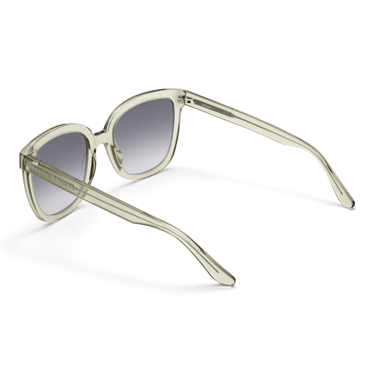 Grande Bio-Acetate Olive Olive sunglasses with a clear olive oversized square frame, black gradient lenses, and lightweight bio-acetate arms, shown from the back to highlight the ergonomic fit and stylish construction.