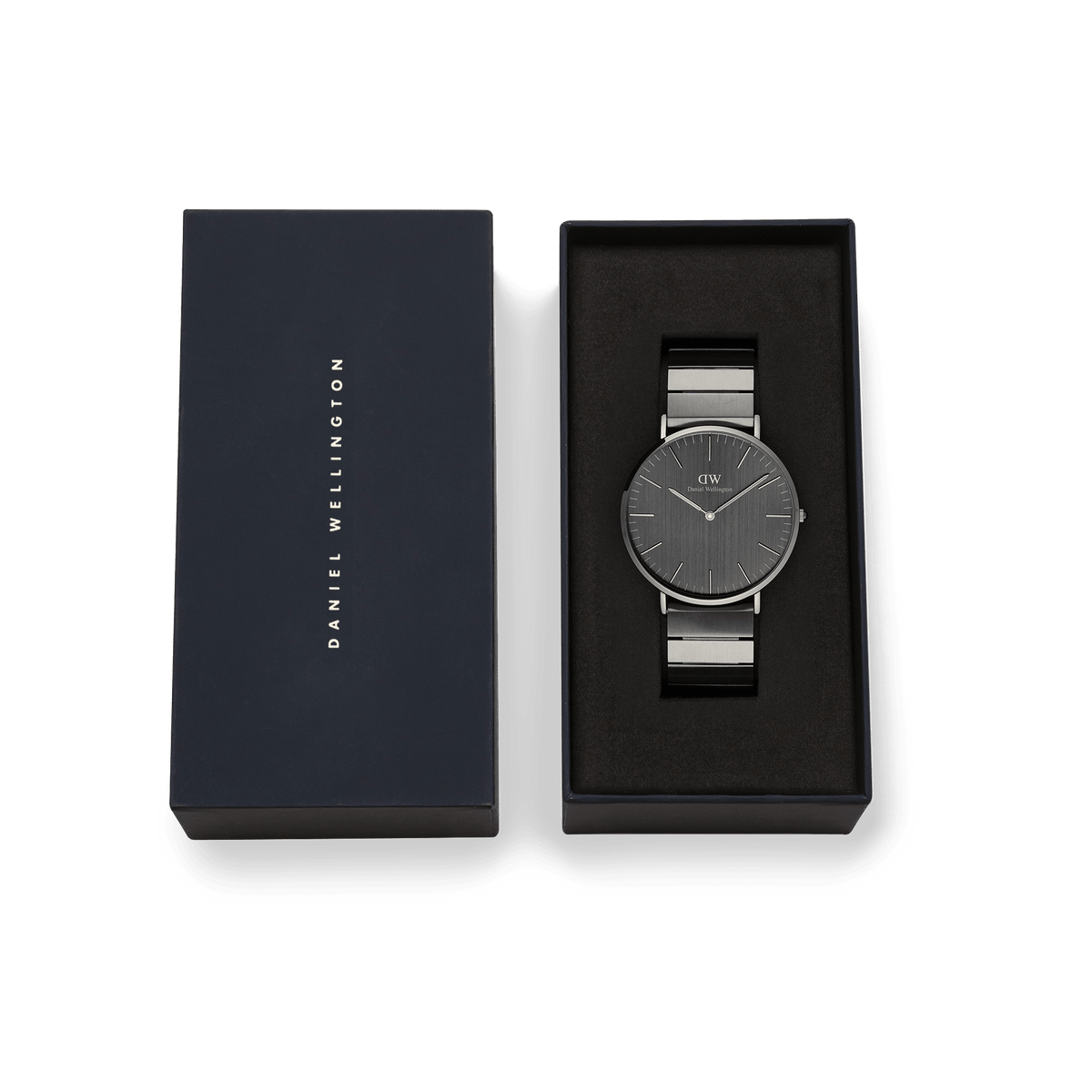 Classic Piano Link Graphite Unitone men's watch presented in its original Daniel Wellington gift box, featuring a brushed graphite dial and a matte stainless steel piano link bracelet.