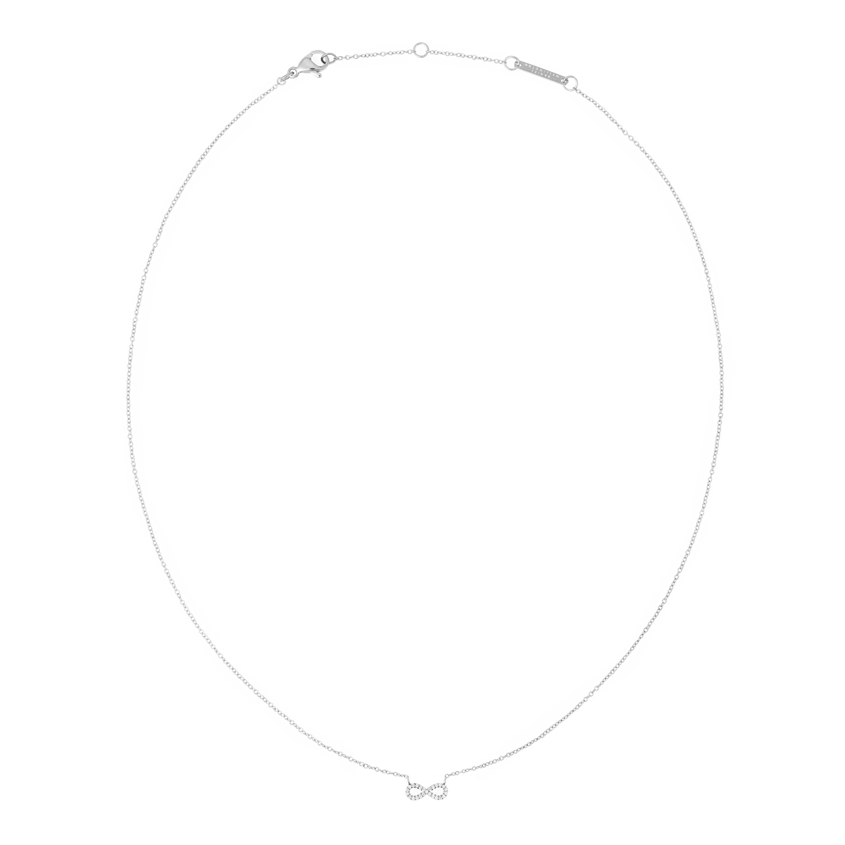 Fine silver chain necklace featuring a minimalist infinity pendant set with white cubic zirconia crystals, designed for everyday wear and easy layering.