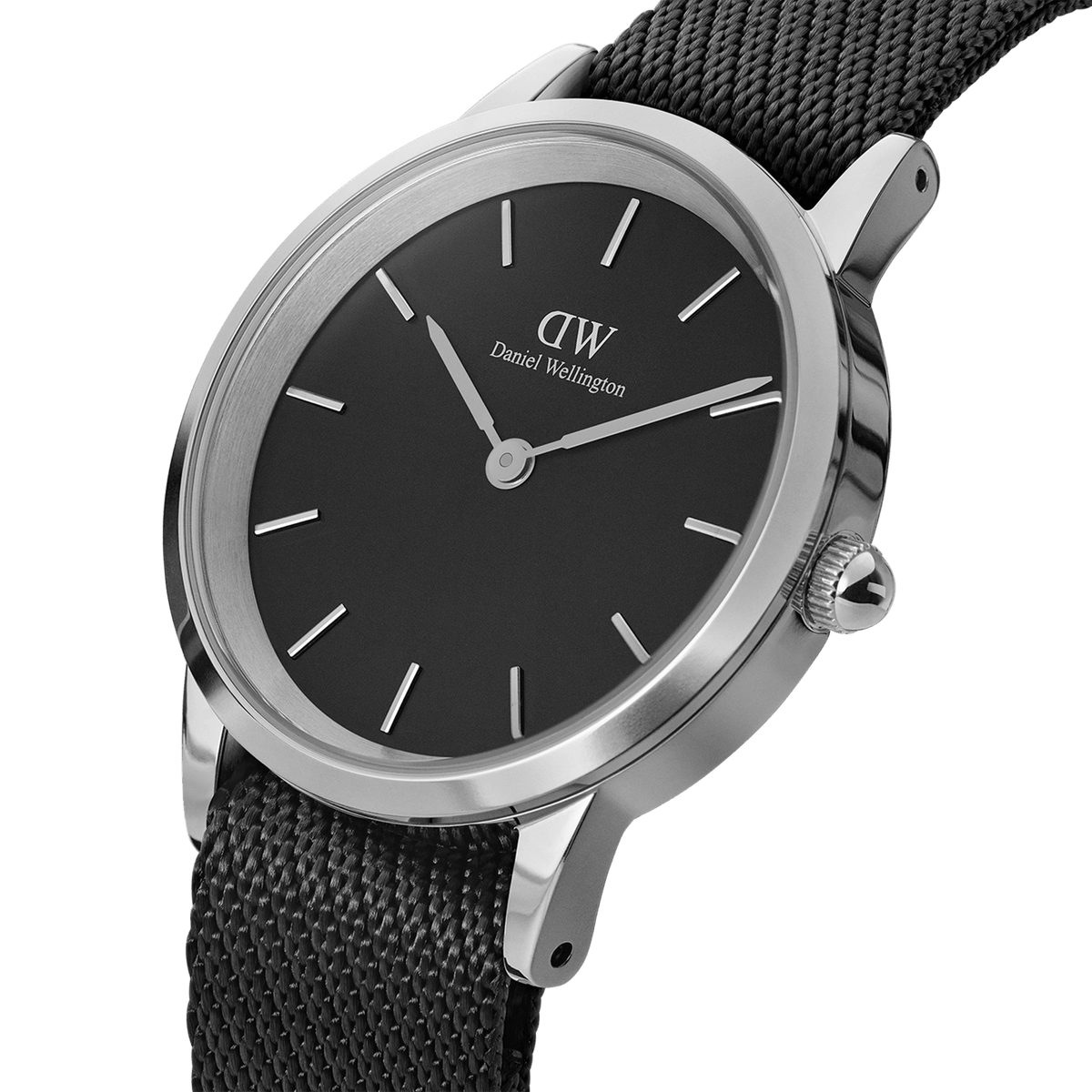 Daniel Wellington Iconic Black NATO Black Dial watch featuring a sleek black dial, polished silver case, and textured black NATO strap, shown at an angle to highlight its minimalist design and refined finish.