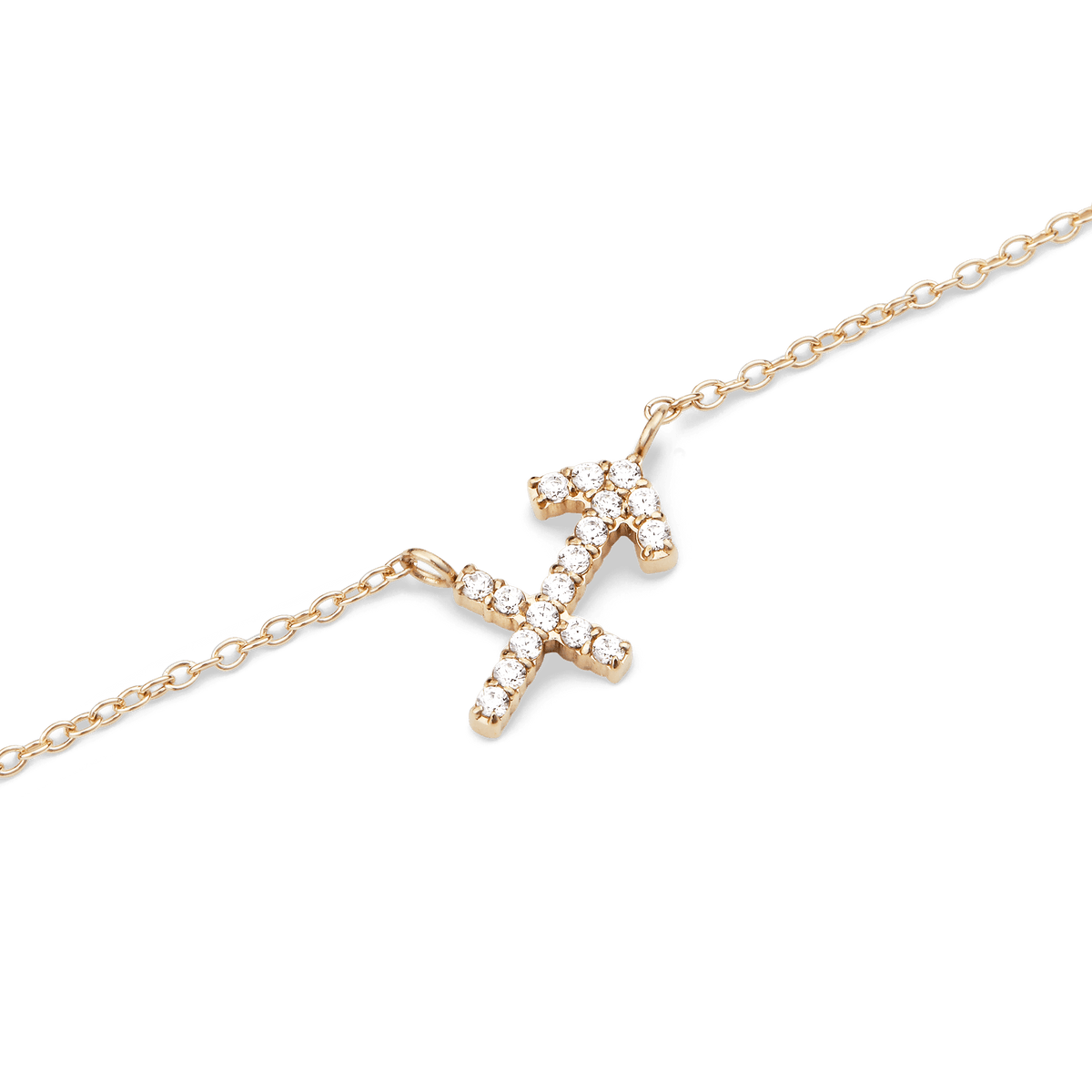 A close-up of the Crystal Zodiac Chain Necklace Gold featuring a Sagittarius pendant set with sparkling crystals on a fine gold chain, highlighting its delicate and modern design.