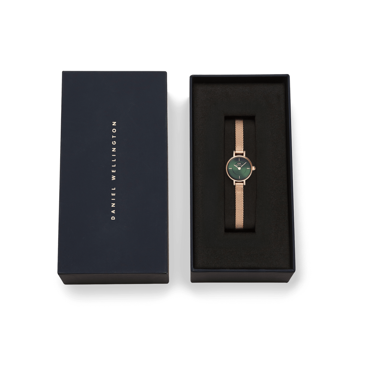 Petite Mini Emerald Melrose watch with a rose gold mesh strap and emerald green dial, presented in a sleek Daniel Wellington gift box.