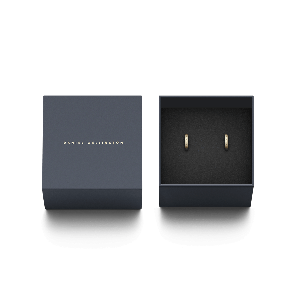 Elan Earrings Gold presented in a sleek Daniel Wellington gift box, featuring two petite gold huggie earrings with engraved branding, ideal for gifting or adding to a jewellery collection.