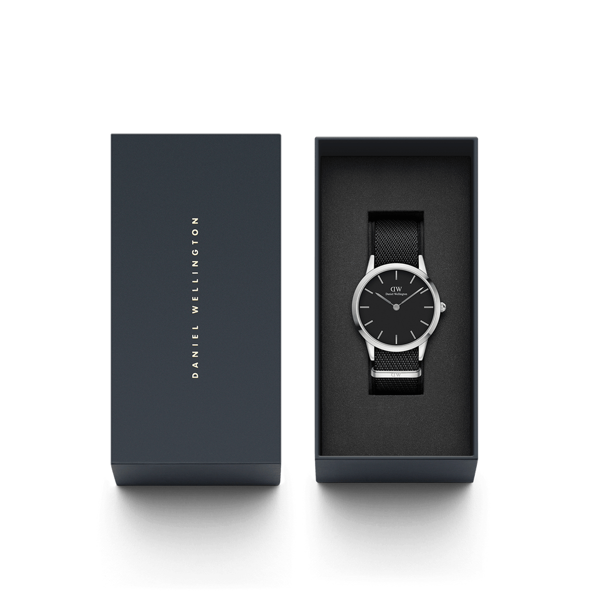 Daniel Wellington Iconic Black NATO Black Dial watch presented in a sleek branded gift box, showcasing its minimalist black dial, polished silver case, and textured black NATO strap.