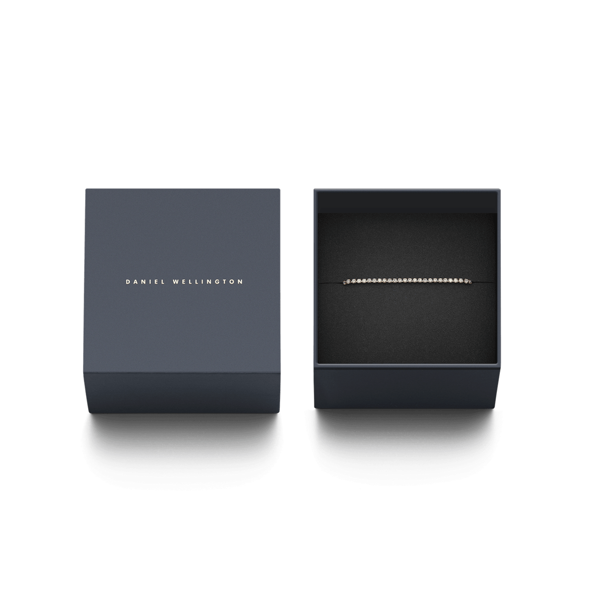 Classic Tennis Bracelet Rose Gold presented in an elegant Daniel Wellington gift box, highlighting its delicate rose gold chain and sparkling cubic zirconia stones.