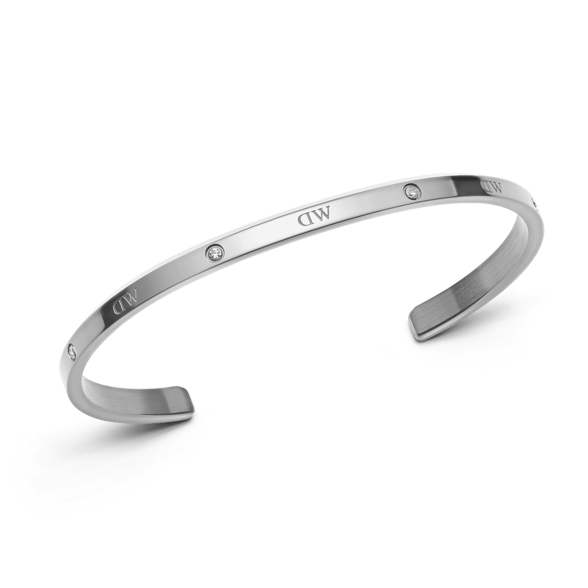 Classic Lumine Bracelet S shown as a slim, open silver cuff with six sparkling crystals and a polished finish, designed for comfortable stacking and everyday elegance.