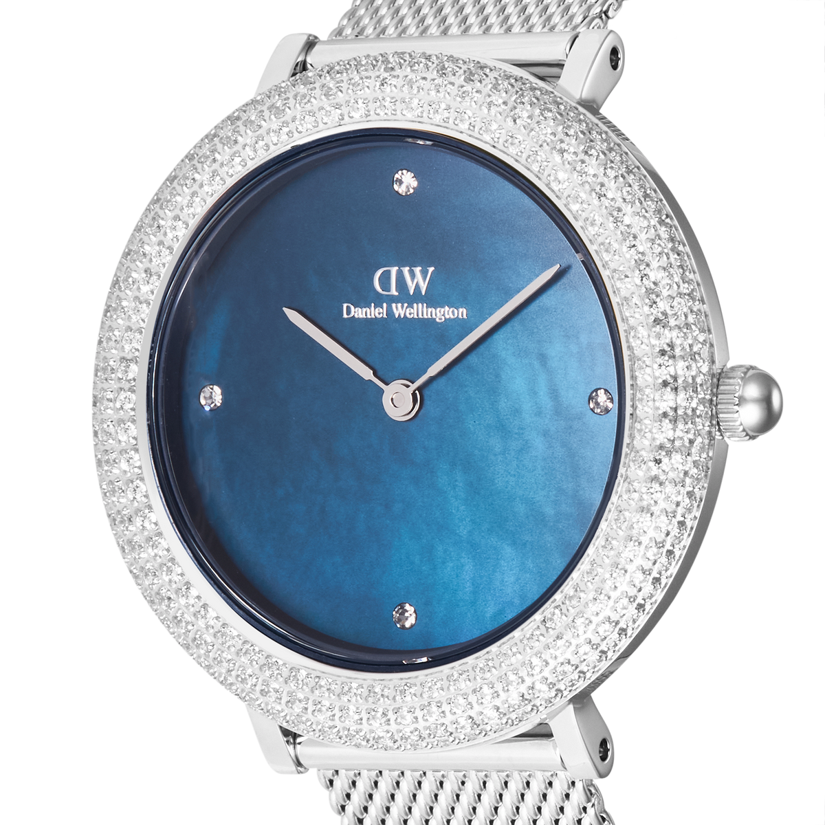 Close-up of the Daniel Wellington Crystalline Bezel Sterling Blue ladies watch showing the blue mother of pearl dial, crystal hour markers, and a double row of sparkling stones on the bezel.