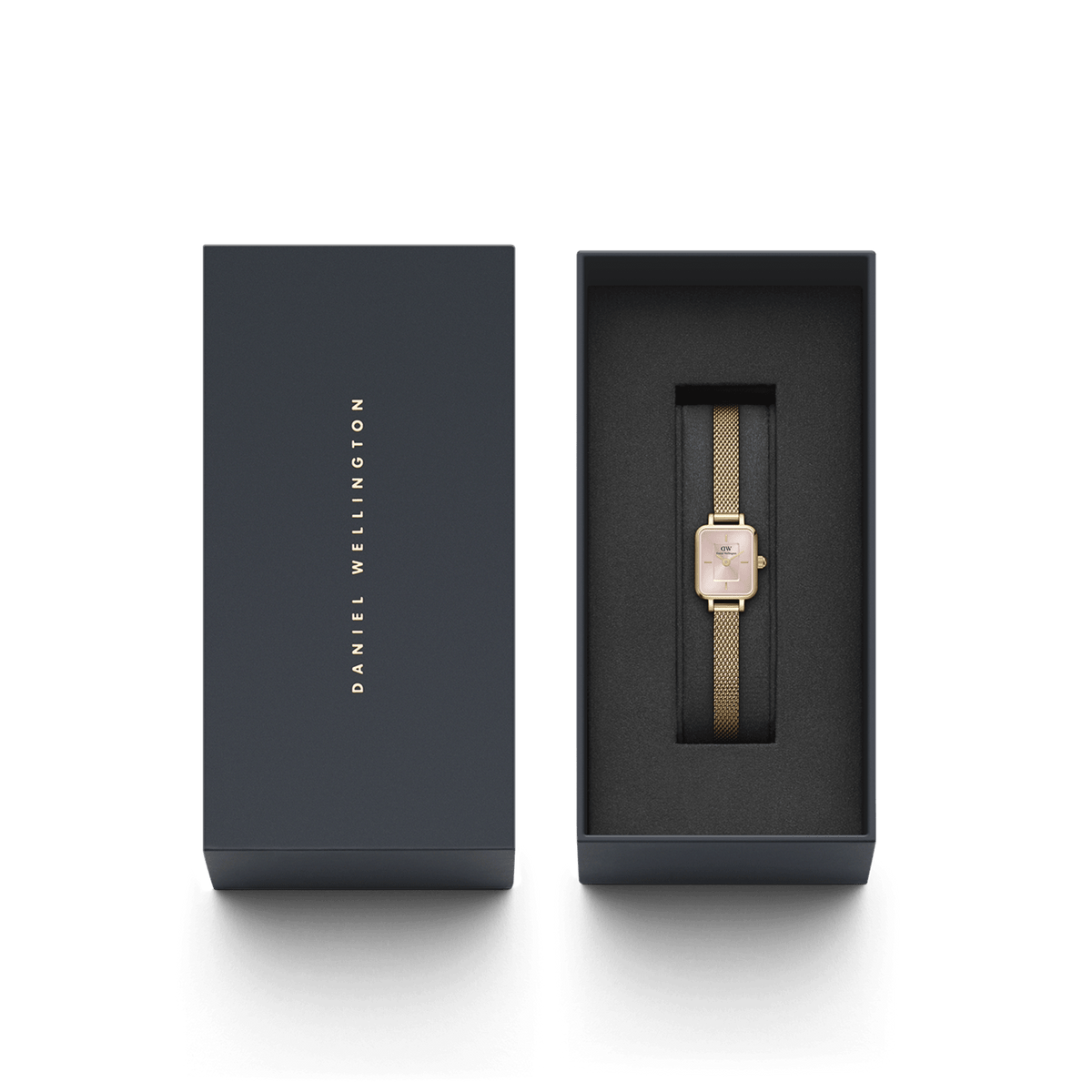 Quadro Mini Evergold Blush gold watch with a blush pink dial and gold mesh strap, elegantly presented in a black Daniel Wellington gift box.