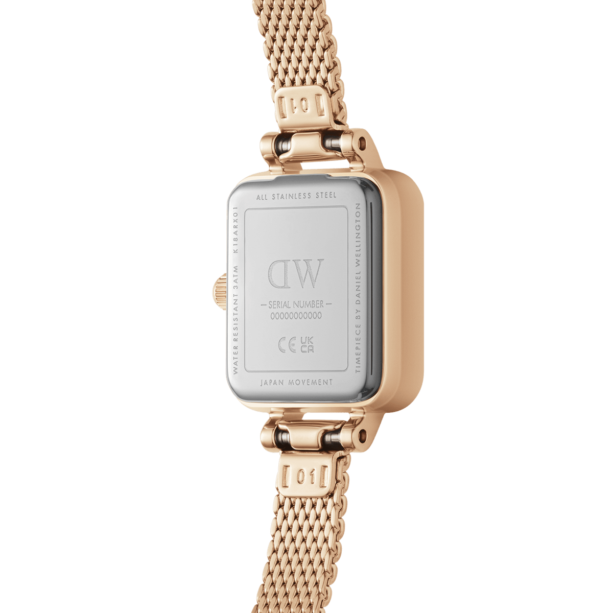 The back view of the Quadro Mini Melrose Amber reveals its stainless steel case, rose gold mesh strap, and engraved details, highlighting its Japanese quartz movement and water resistance.