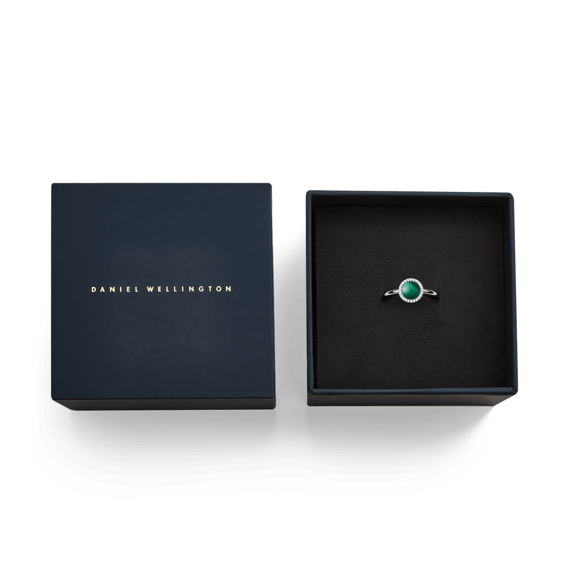 Audrey Ring Malachite Silver presented in an open Daniel Wellington gift box, showcasing the silver band with a green malachite centre and sparkling cubic zirconia halo.