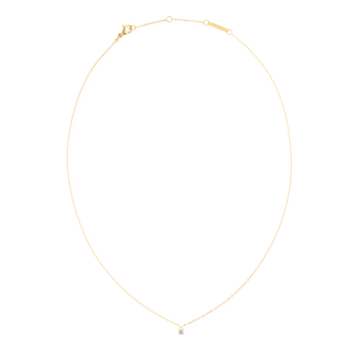 Mirelle Solitaire Necklace Gold with a fine adjustable gold chain and a single white cubic zirconia pendant, shown laid flat to highlight its minimalist and elegant design.