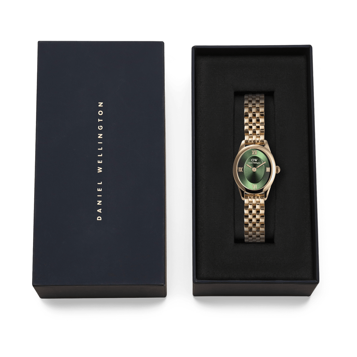 Ophelia Mini Emerald Gold watch with a gold beans link bracelet and emerald green sunray dial, presented in a black Daniel Wellington gift box.