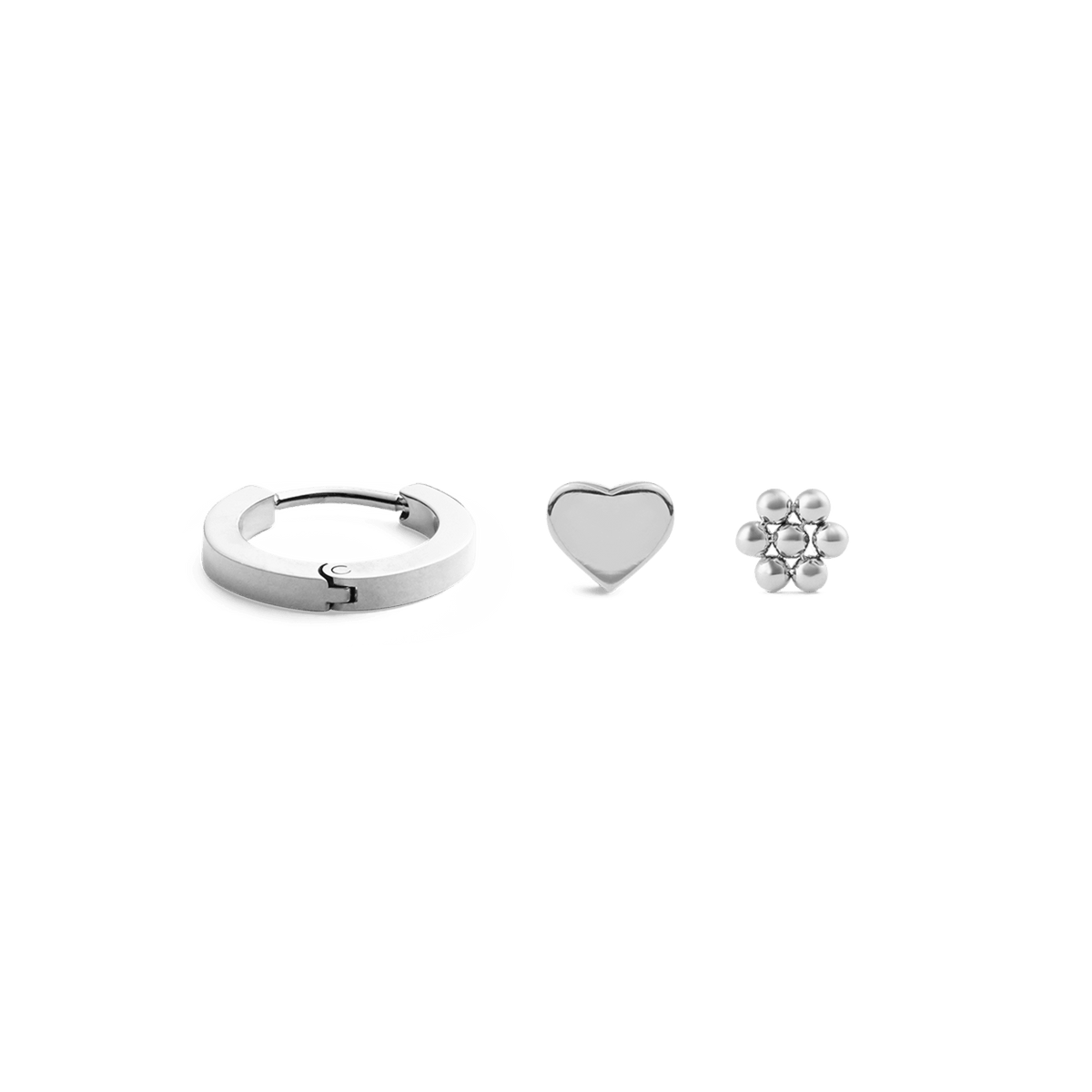 Silver earring set featuring a small hoop, a heart-shaped stud, and a flower stud, each with a polished finish and minimalist design, ideal for mix-and-match styling.