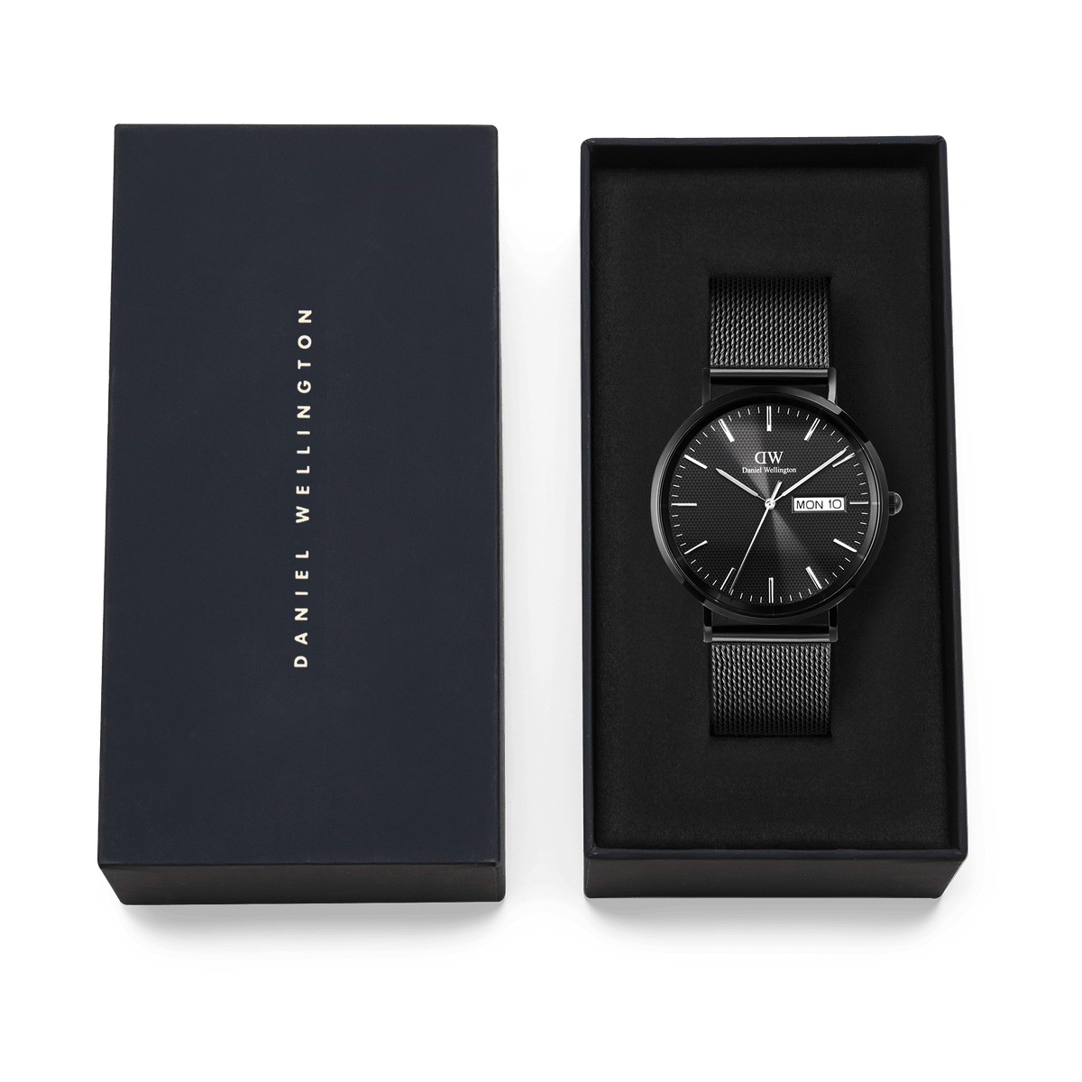 Classic Day Display Onyx Black watch with a black mesh strap, presented in a Daniel Wellington branded gift box, highlighting its elegant packaging for gifting or collection.