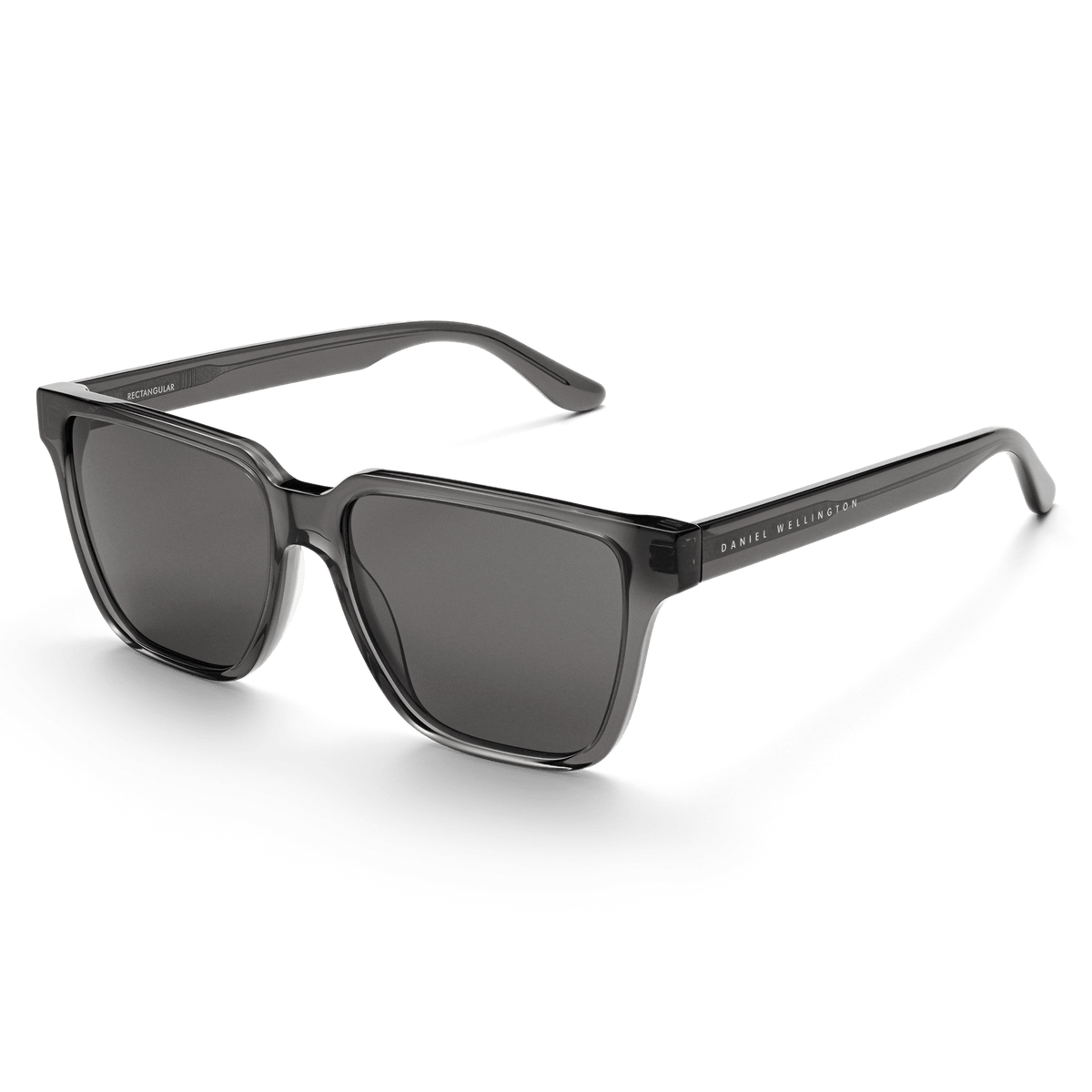 Rectangular Bio-Acetate Grey Grey sunglasses featuring a transparent grey oversized frame, matching grey UV400 lenses, and Daniel Wellington branding on the temple for a stylish and durable look.