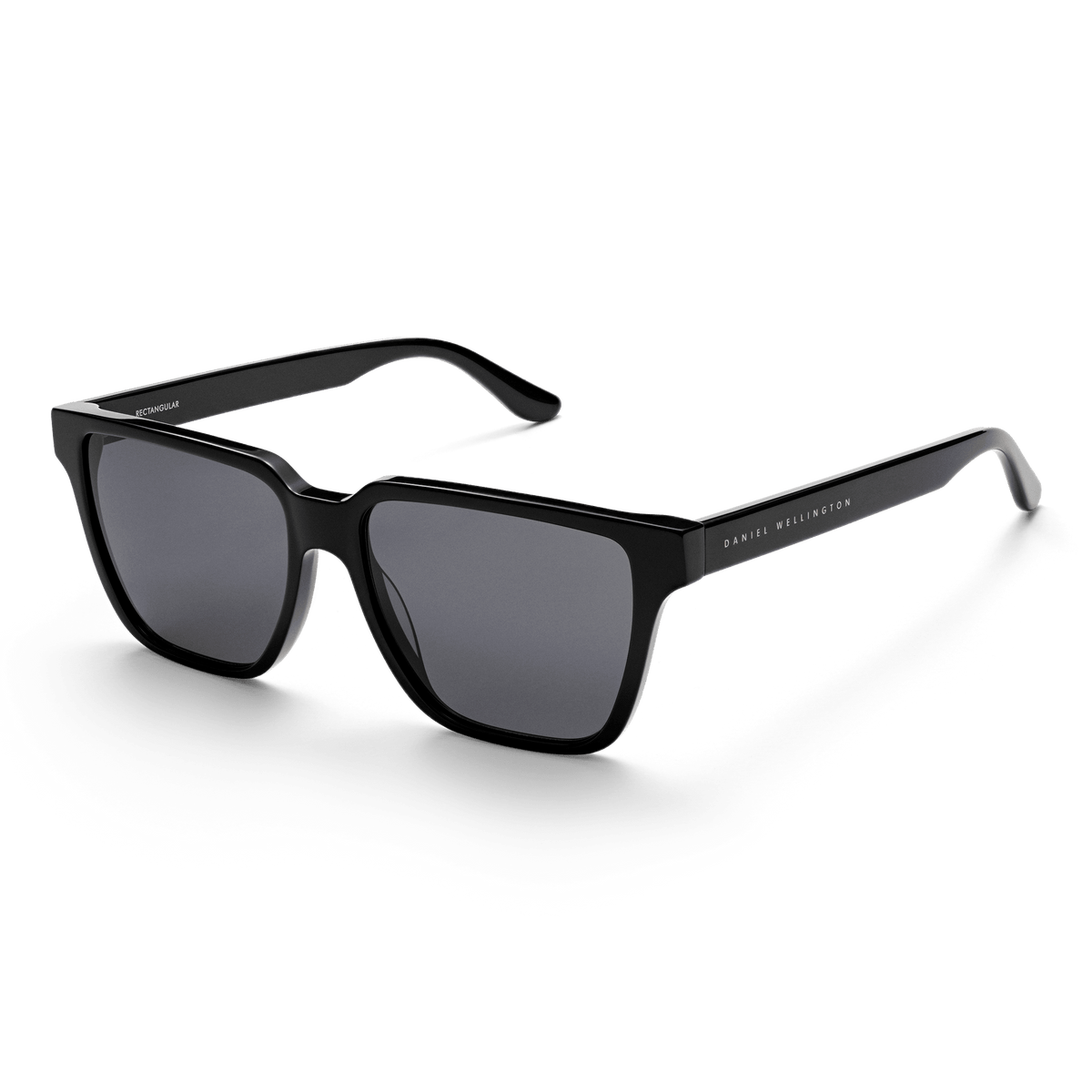 Rectangular Bio-Acetate Black sunglasses with a bold black oversized frame, UV400 nylon lenses, and Daniel Wellington branding on the temples, offering a stylish and contemporary look for men.