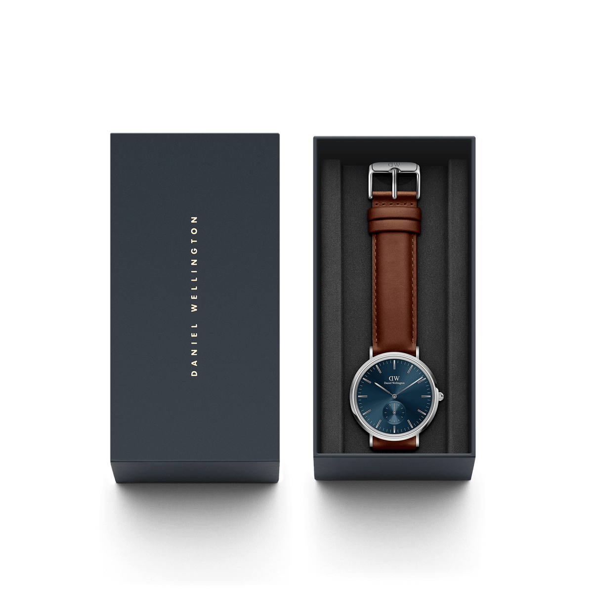 Classic Multi-Eye St Mawes Arctic Silver men's watch with a deep blue dial and brown leather strap, presented in a branded Daniel Wellington gift box.