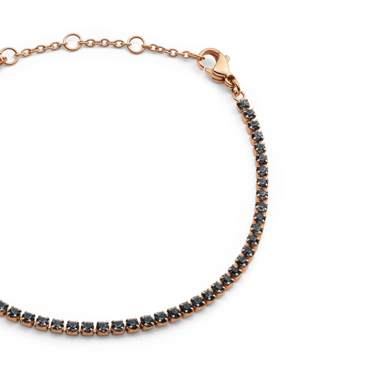 Close-up of the Classic Tennis Bracelet Nightfall Rose Gold, highlighting the row of dark Preciosa crystals set in rose gold with an adjustable chain and lobster clasp for a secure, elegant fit.