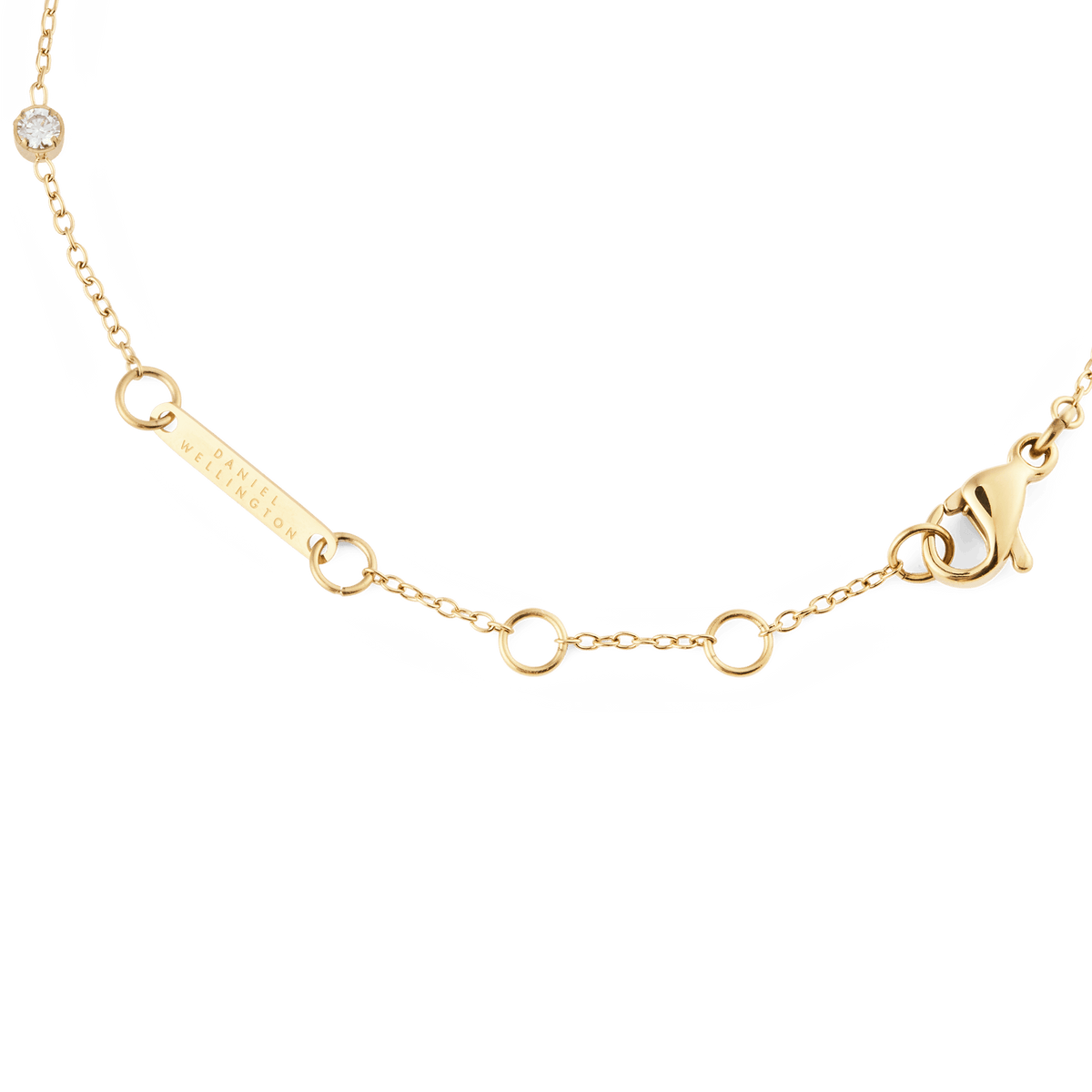 Detail of the Pearl Bracelet Gold showing the adjustable gold chain with a secure lobster clasp, Daniel Wellington branding, and a single cubic zirconia stone.