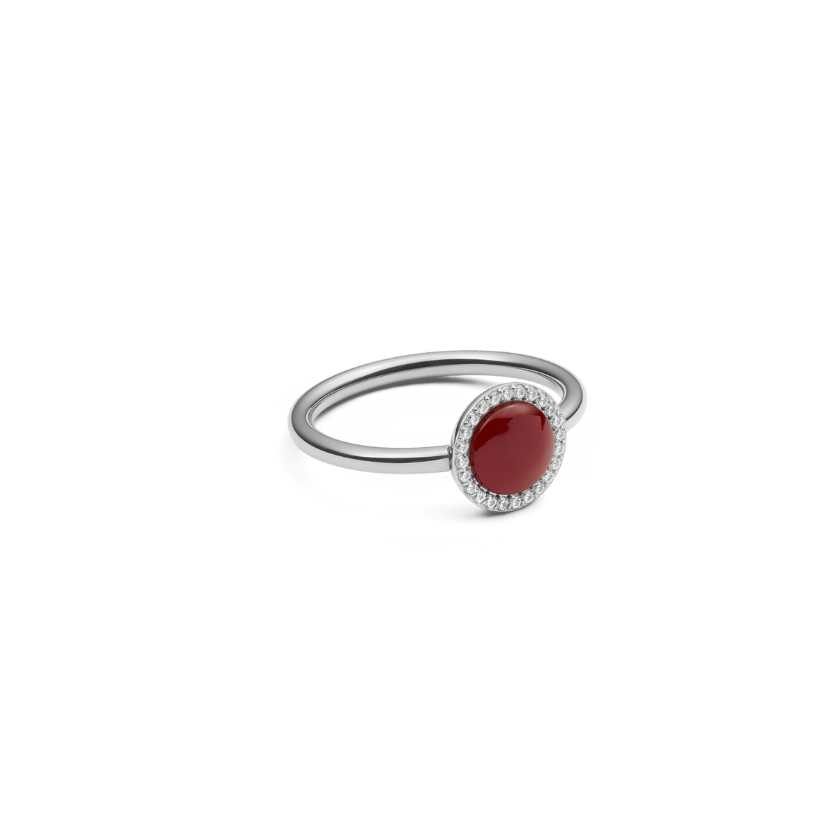 Audrey Ring Red Agathe Silver featuring a slim silver band with a deep red agate stone and a halo of white cubic zirconia crystals, shown from a side angle to highlight its elegant setting.