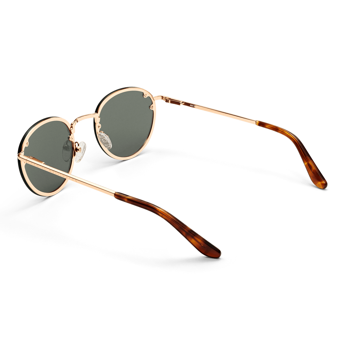 Arch Steel Green Rose Gold sunglasses with round green UV400 lenses, rose gold plated stainless steel frame, and tortoiseshell acetate temple tips, shown from a rear angle to highlight the adjustable silicone nose pads and sleek arm design.