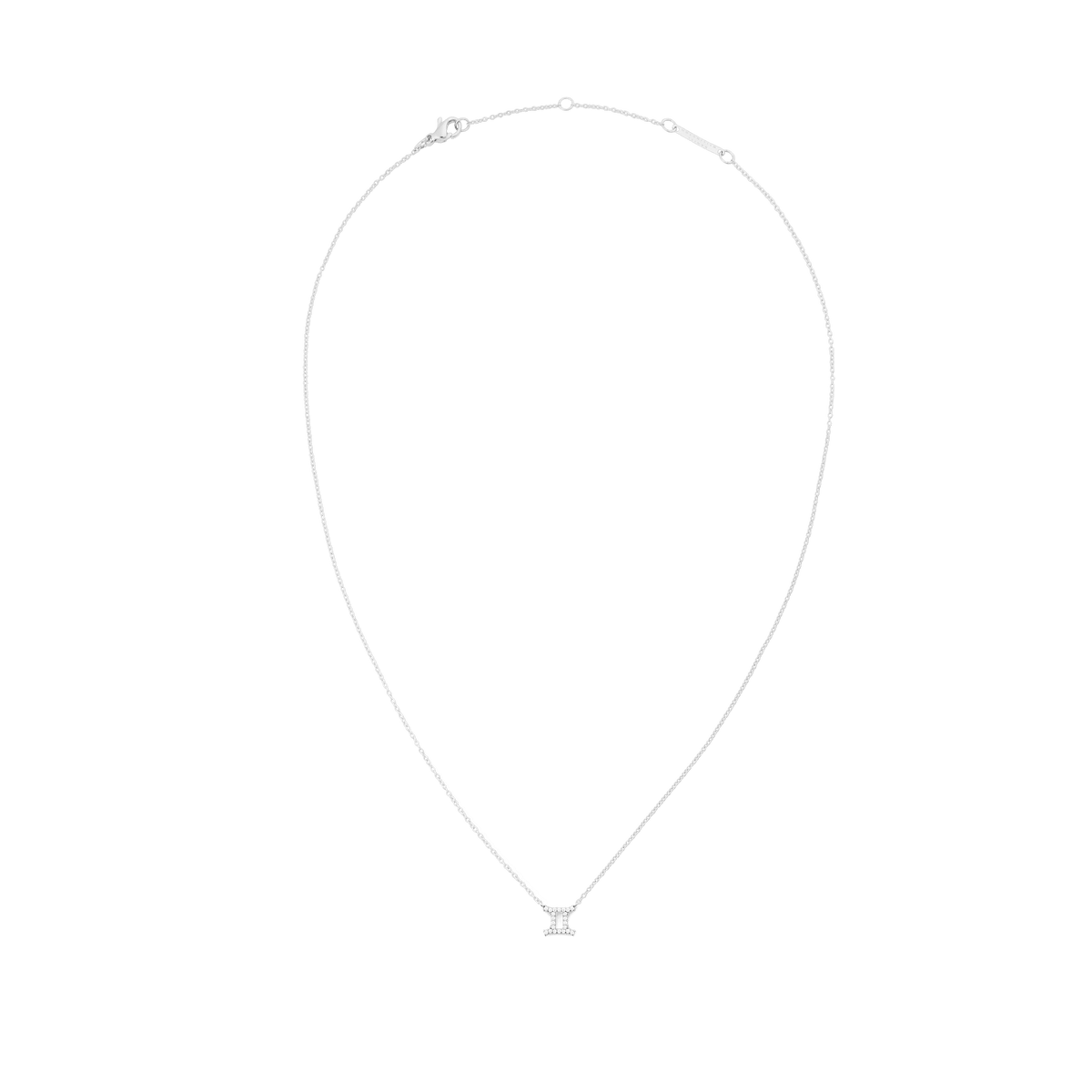 A delicate silver chain necklace featuring a Gemini zodiac pendant adorned with sparkling crystals, designed for a minimalist and elegant look.