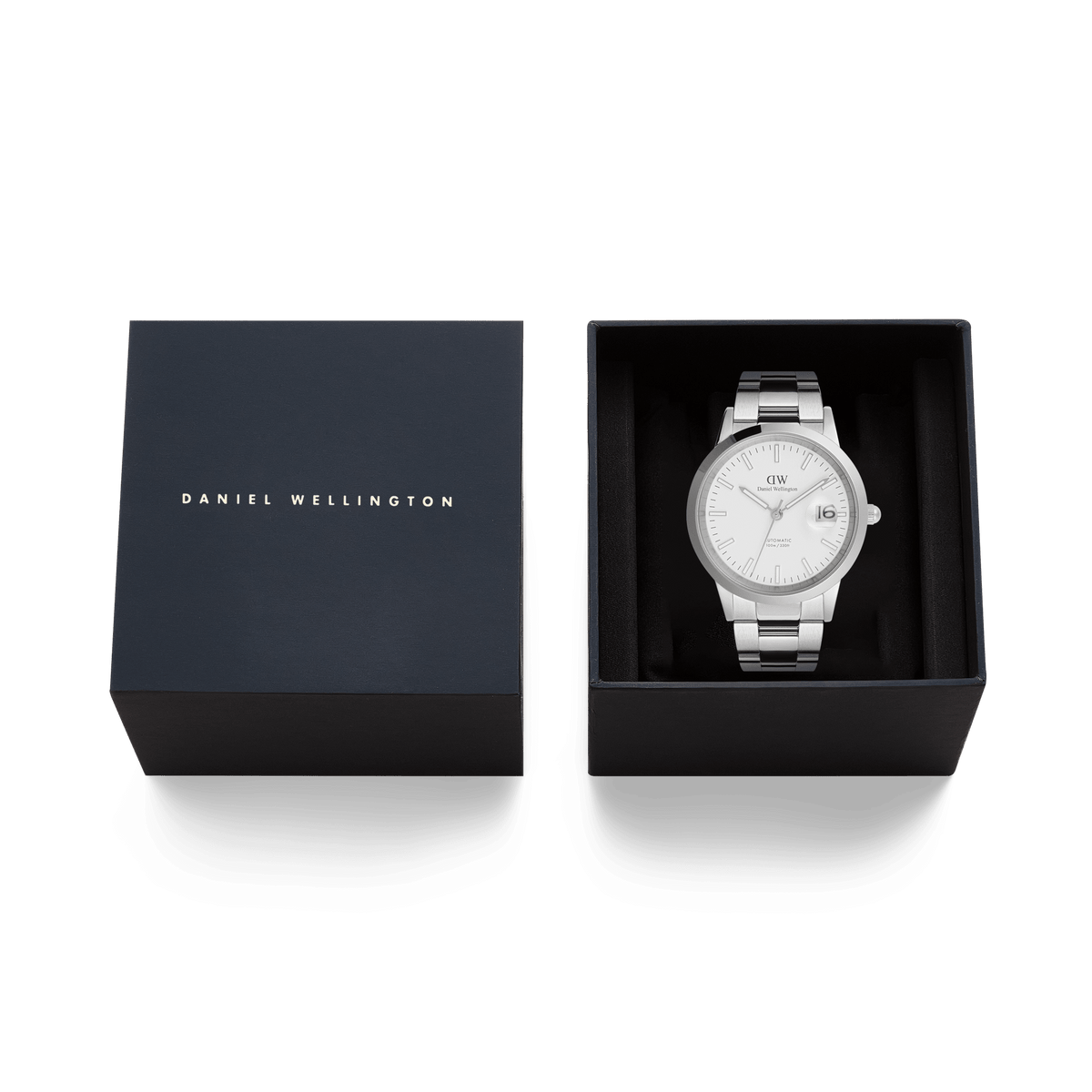Daniel Wellington Iconic Link Automatic Silver men’s watch with a stainless steel bracelet, presented in a branded gift box with the lid beside it.
