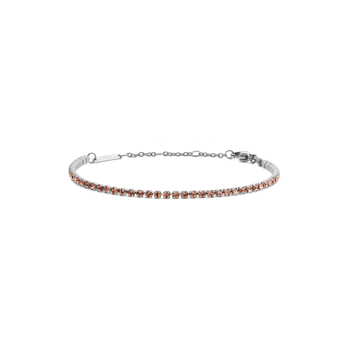 A slim silver tennis bracelet featuring apricot-coloured crystals set along a delicate chain, with an adjustable clasp for a comfortable fit.