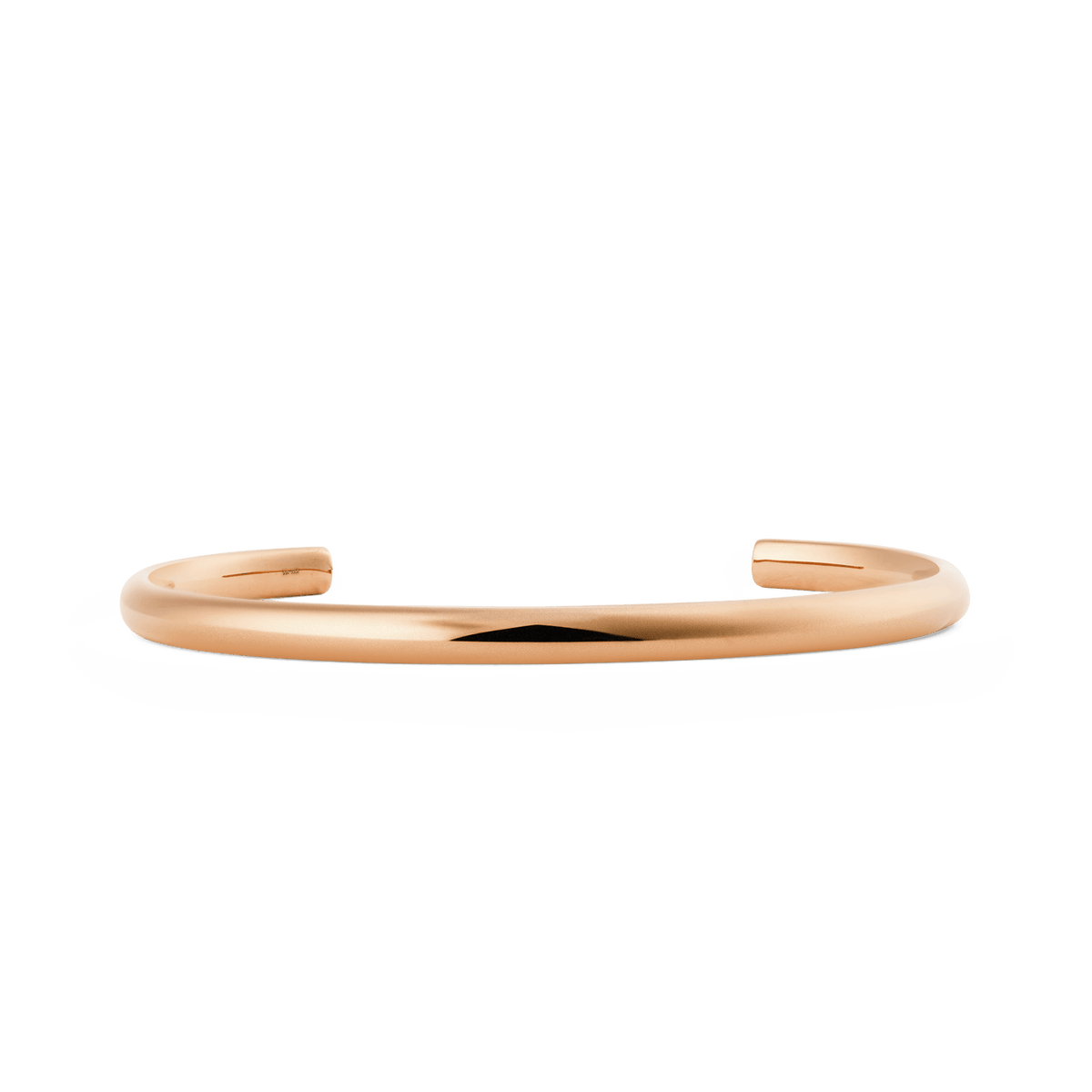 Slim rose gold cuff bracelet with a softly rounded, minimalist design and a polished finish, featuring an open-ended adjustable style suitable for everyday wear.