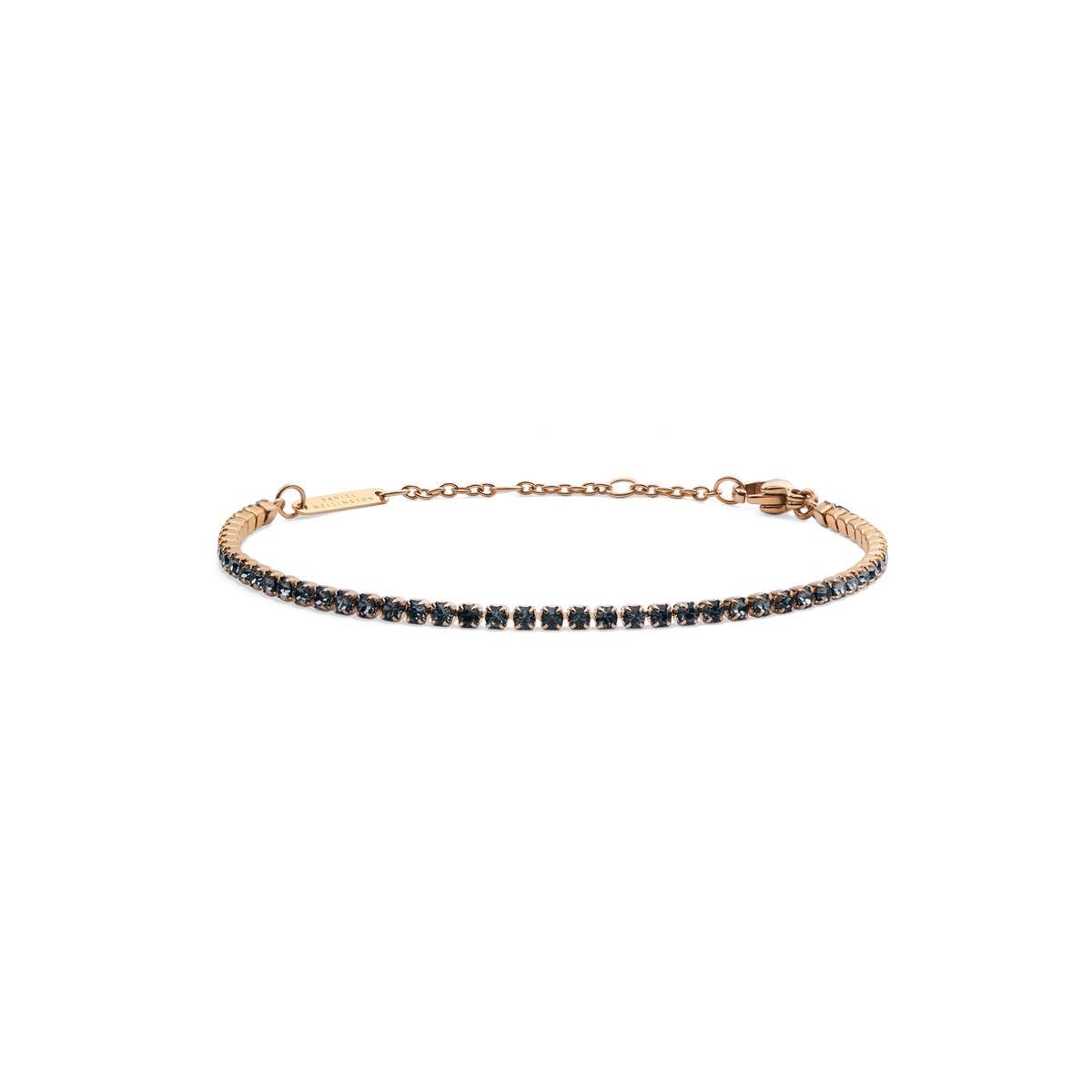 Slim rose gold tennis bracelet featuring a single row of dark Preciosa crystals, with an adjustable chain and lobster clasp for a comfortable, elegant fit.