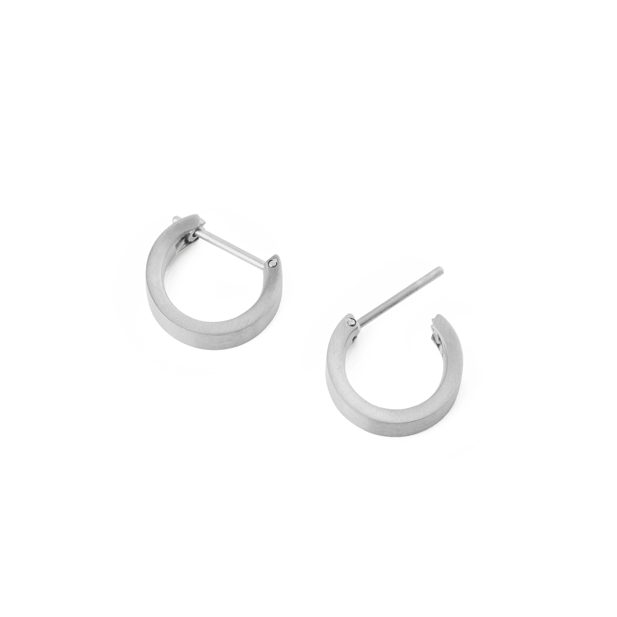 A pair of Line Earring Brushed Silver 3.5mm hoop earrings shown open, highlighting their softly brushed silver finish, minimalist design, and secure latch-back posts.