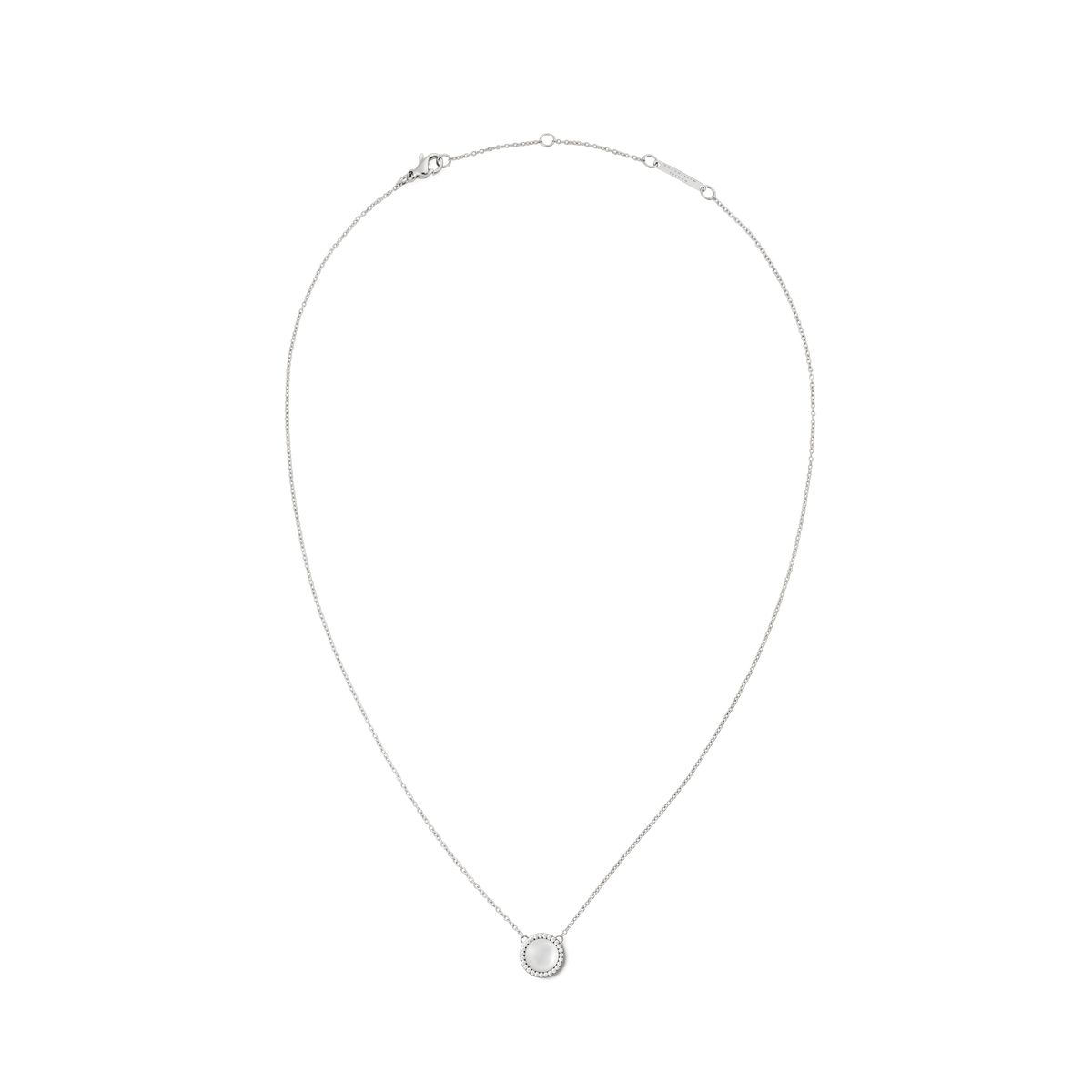 Silver necklace with a delicate chain featuring a round mother of pearl pendant framed by a halo of white cubic zirconia crystals, highlighting its minimalist and elegant design.
