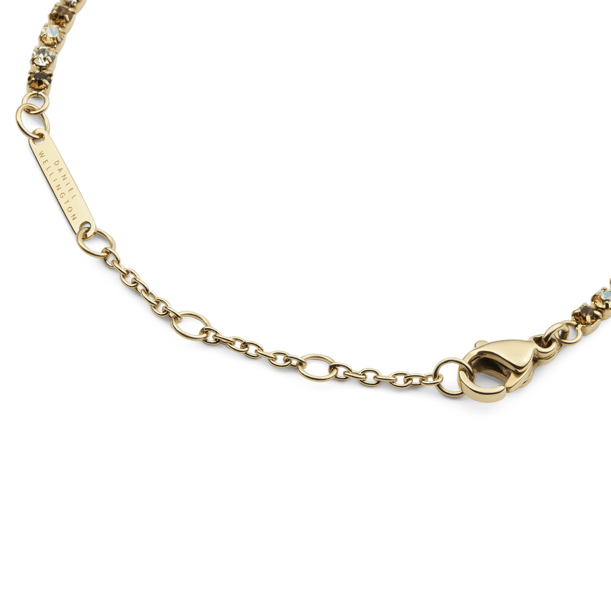Detail view of the Classic Tennis Bracelet Honey Combo Gold, highlighting the adjustable sizing rings, lobster clasp, and gold chain with individually set honey and clear crystals.