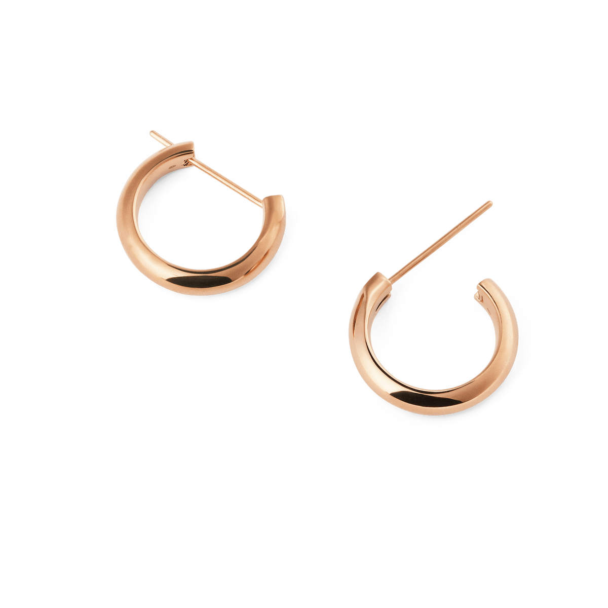 Arch Earring Rose Gold 12mm hoop earrings with a polished rose gold finish, shown apart to highlight their petite size, minimalist rounded shape and classic pin closure.