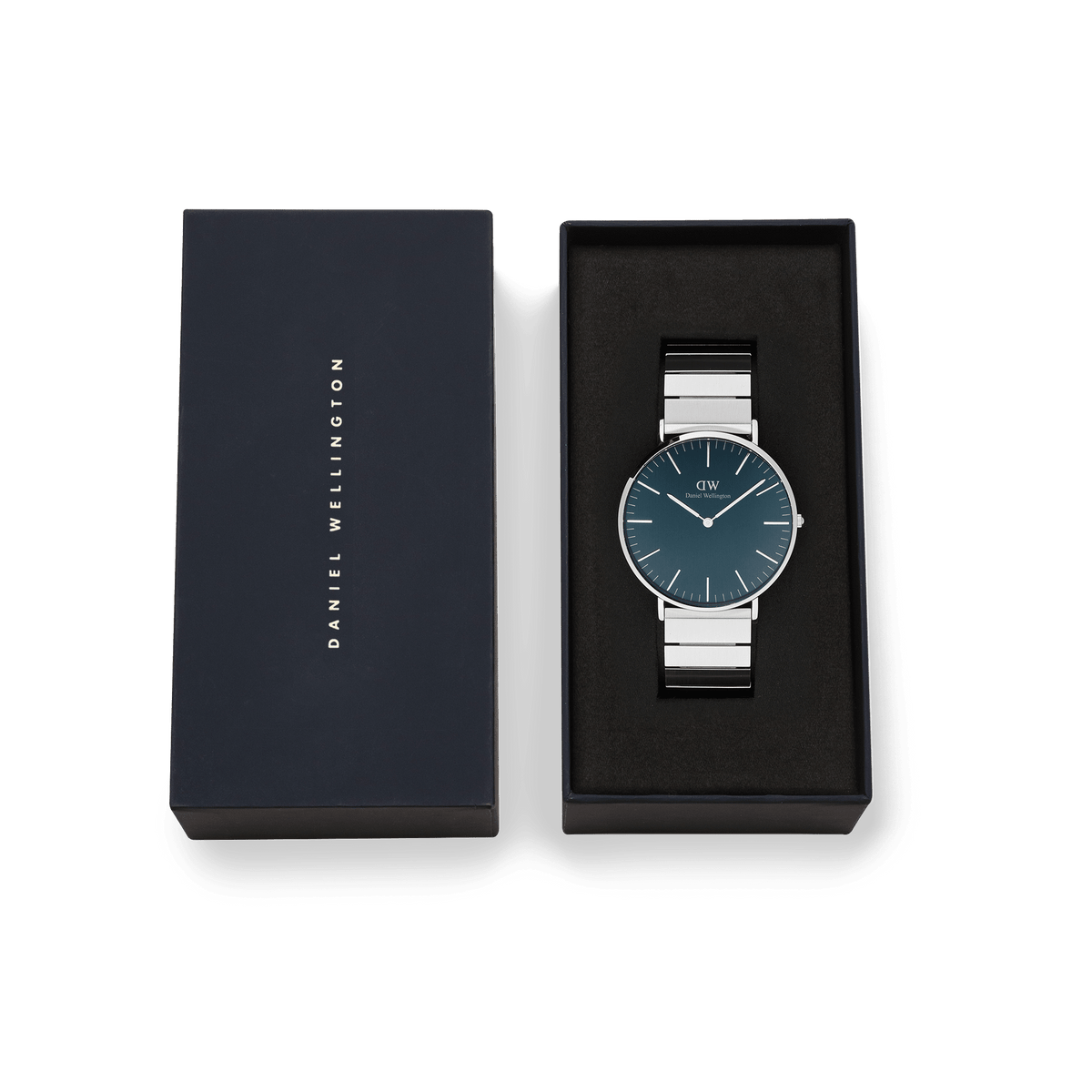 Classic Piano Link Arctic Silver watch with a brushed arctic blue dial and stainless steel piano link strap, presented in a black Daniel Wellington gift box.