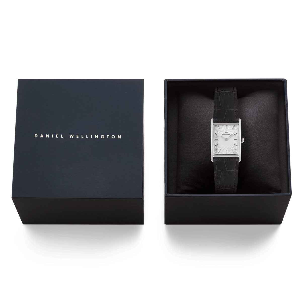 Bound Black Crocodile Guilloché Silver watch presented in a Daniel Wellington gift box, highlighting its rectangular silver case, white guilloché-patterned dial, and black crocodile-embossed leather strap.