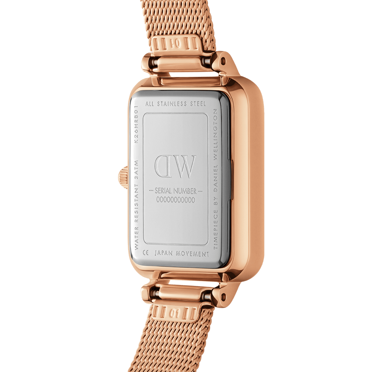 Back view of the Quadro Lumine Bezel Melrose Pink MOP rose gold watch, showing the stainless steel case, engraved details, and mesh strap attachment.