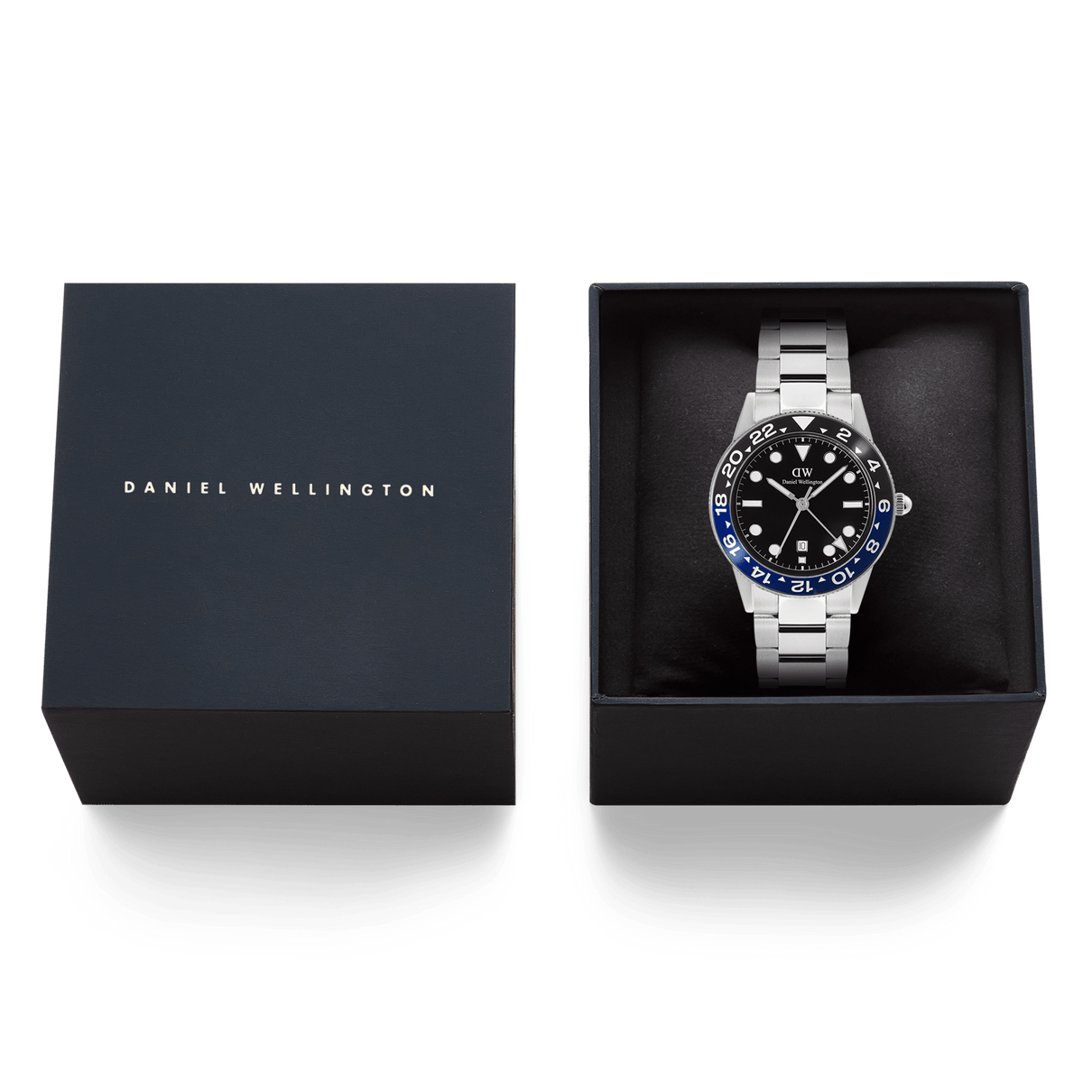 Daniel Wellington Iconic GMT Link Black Blue Ceramic Bezel Silver watch presented in its branded gift box, featuring a black dial, blue and black ceramic bezel, and a silver stainless steel bracelet.