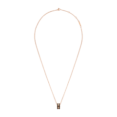 Emalie Necklace Rose Gold Black features a fine rose gold chain with an adjustable clasp and a bold black enamel pendant, offering a modern and elegant look suitable for both everyday wear and special occasions.