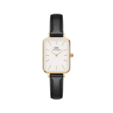 Quadro Pressed Sheffield Gold ladies watch featuring a rectangular gold case, minimalist white dial with gold markers, and a slim black leather strap.